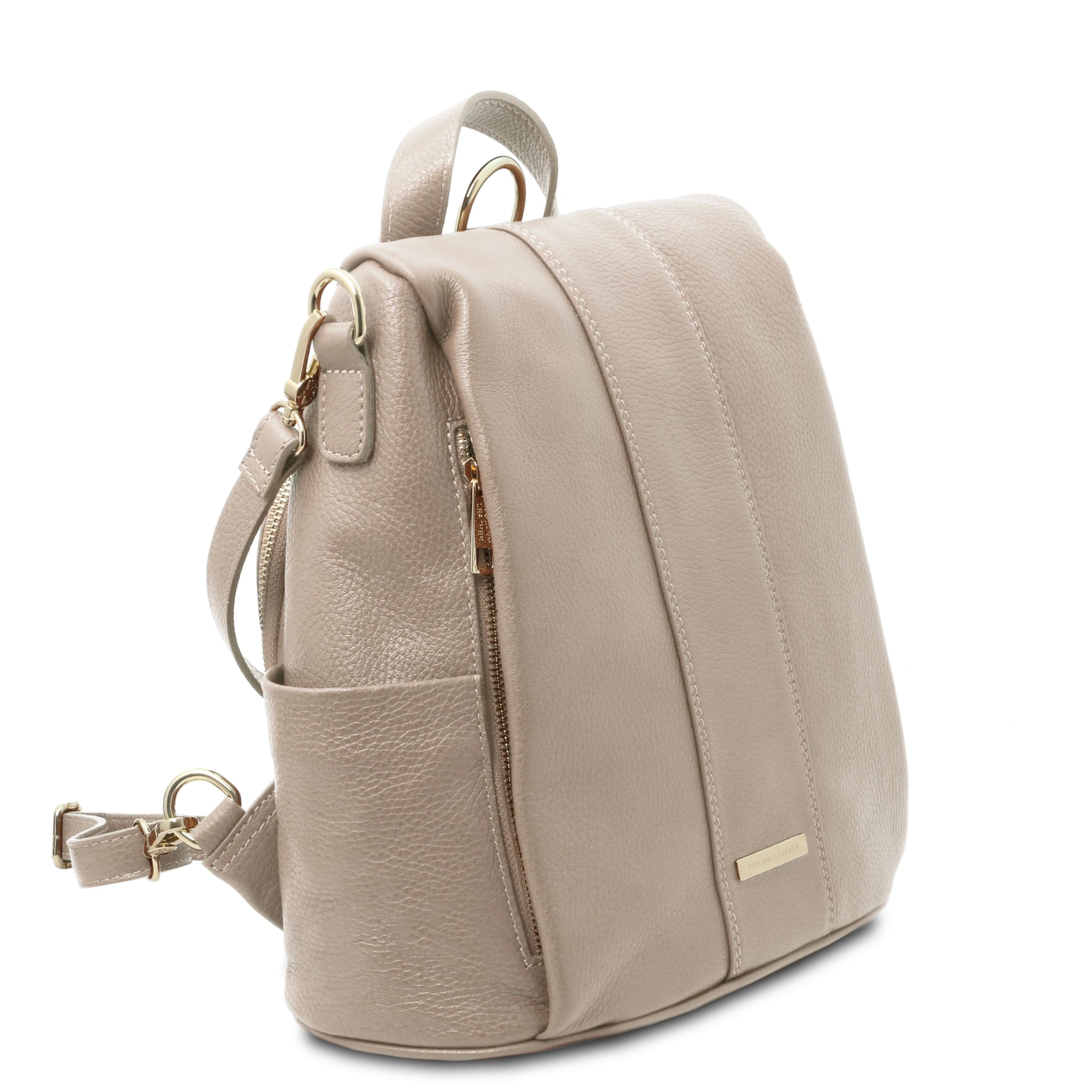 Front side angled View TL Bag Soft Leather Backpack in light taupe showing front cover flap, top handle and backpack straps