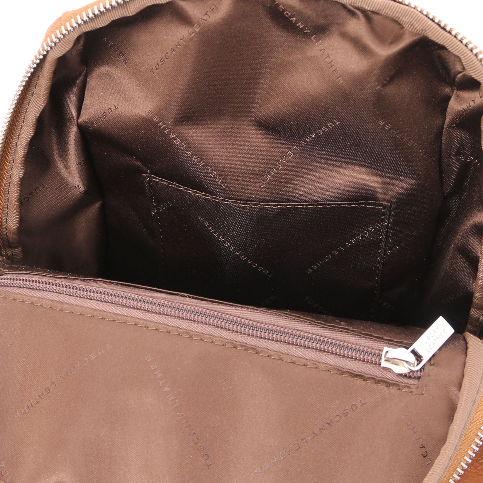 Interior open pocket view TL Bag Soft Italian Leather Backpack in cognac showing brown lining