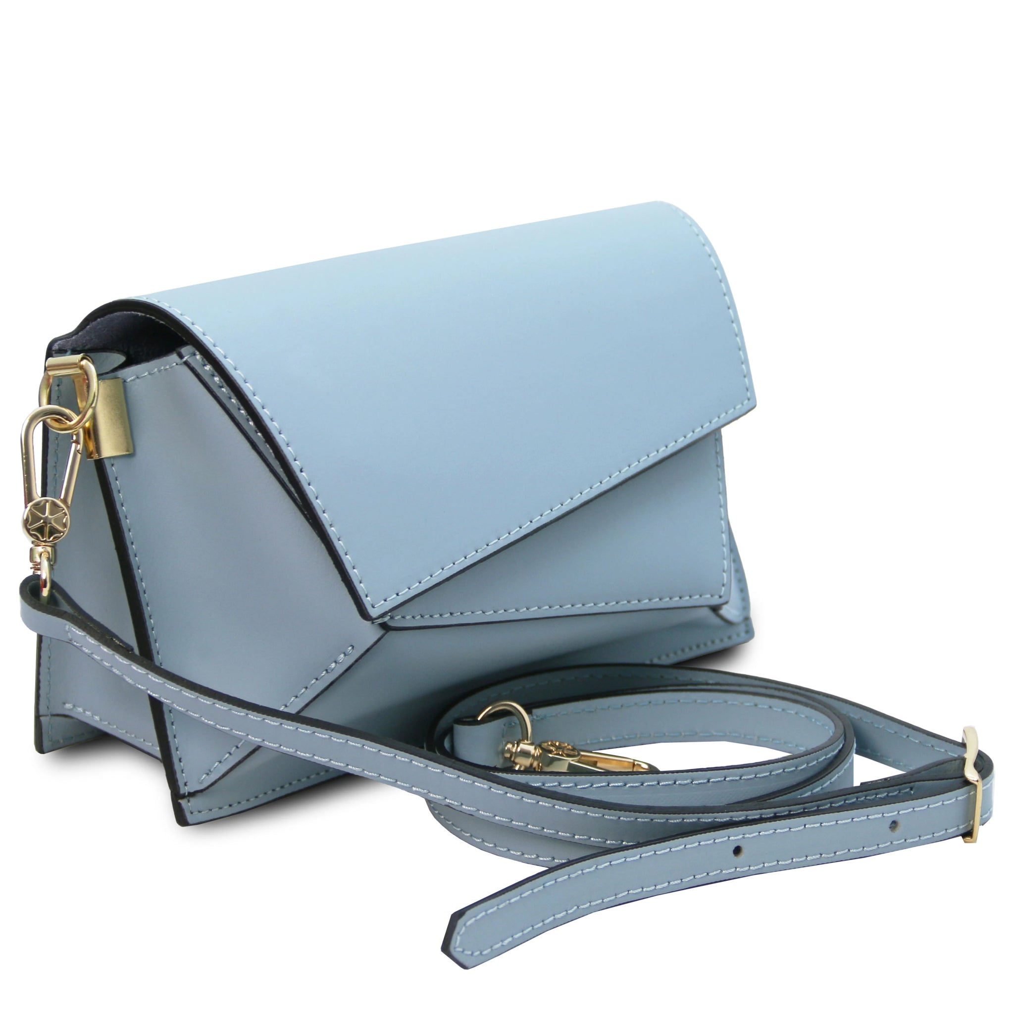 Front angled view TL Leather Assymetrical Shoulder Bag  in Azure showing bag sa a clutch sitting near its deatchable shoulder strap