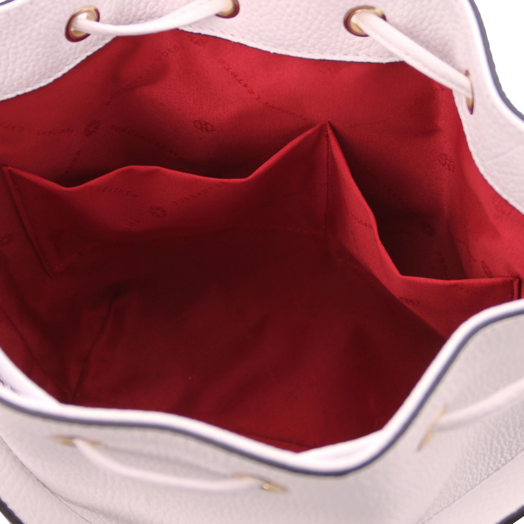 Interior open pocket view of TL Italian Leather Bucket Bag in white with red lining