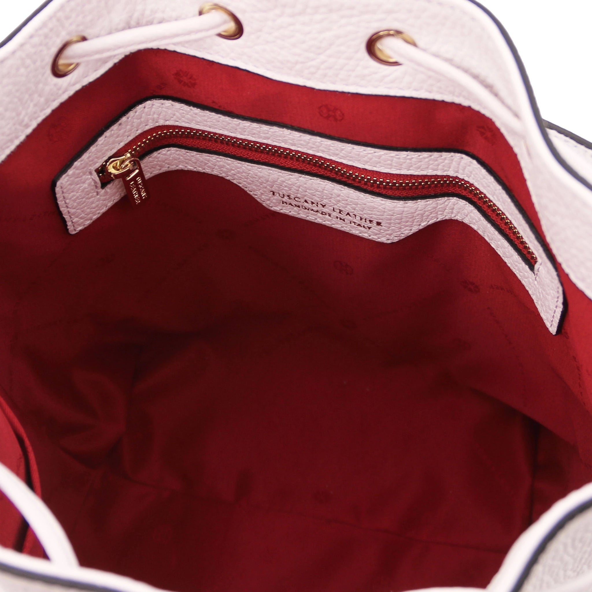 Interior zip pocket view of TL Italian Leather Bucket Bag in white with red lining