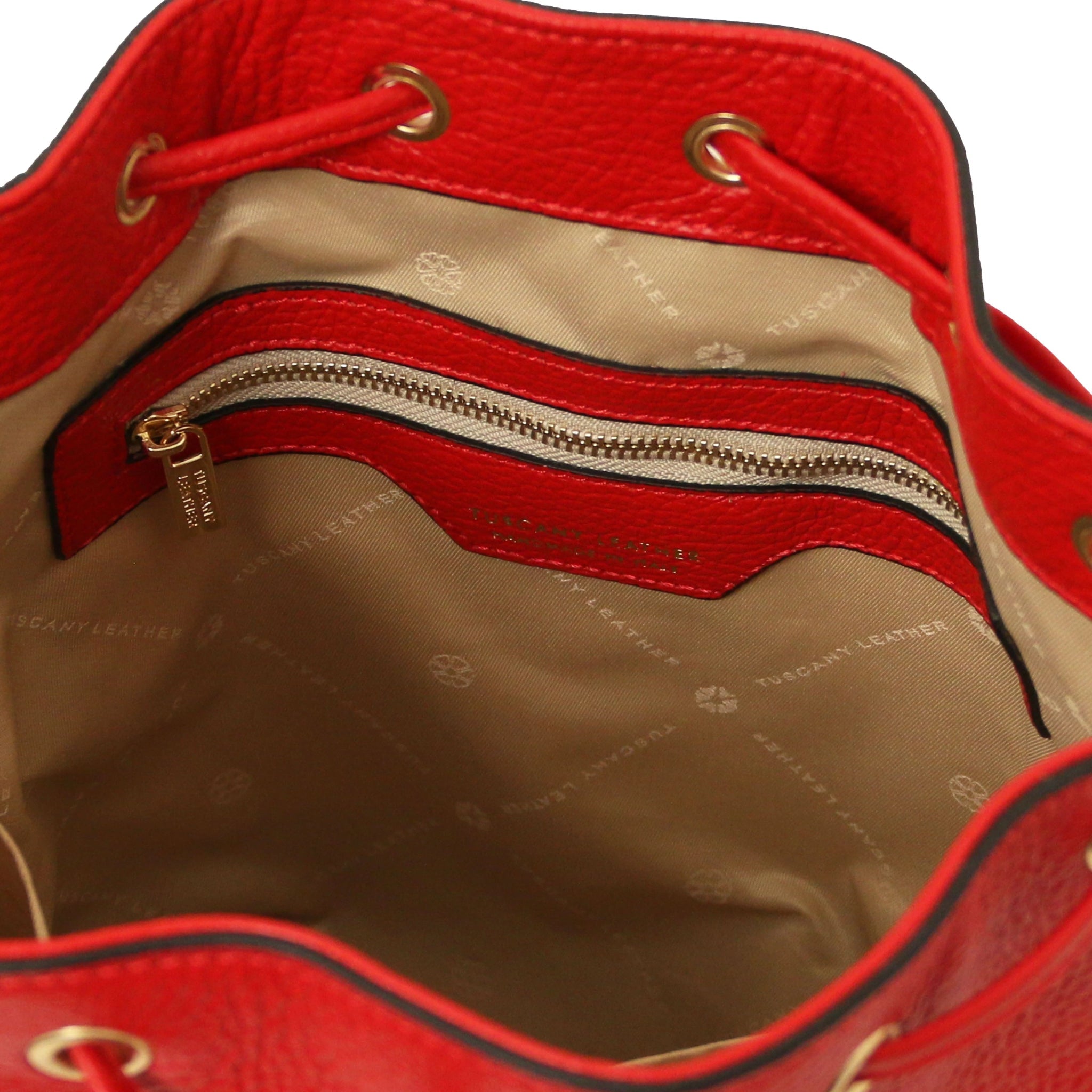Interior zip pocket view of TL Italian Leather Bucket Bag in red with beige lining
