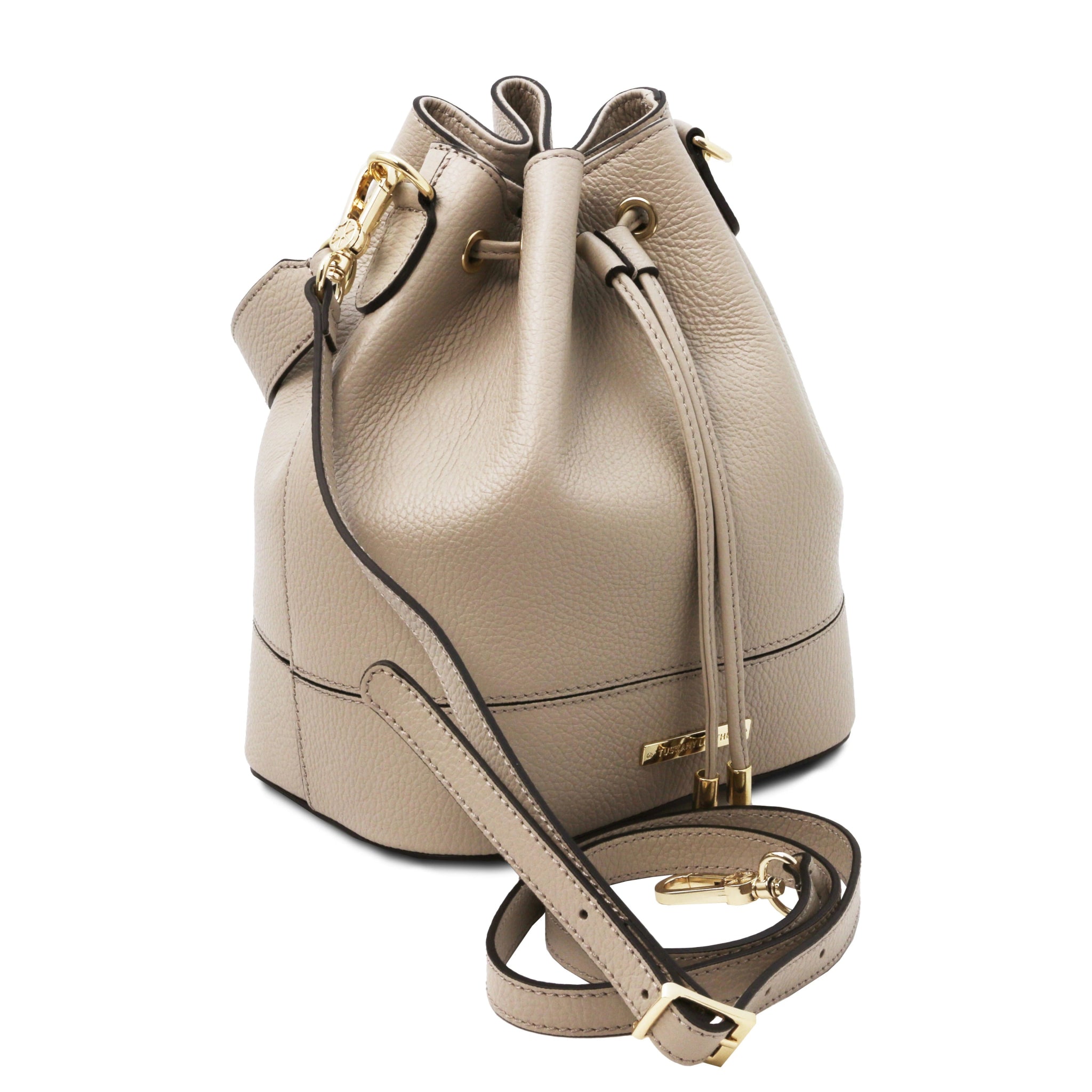 Front angled view TL Italian Leather Bucket Bag in light taupe showing drawstring, handle and detachable shoulder strap
