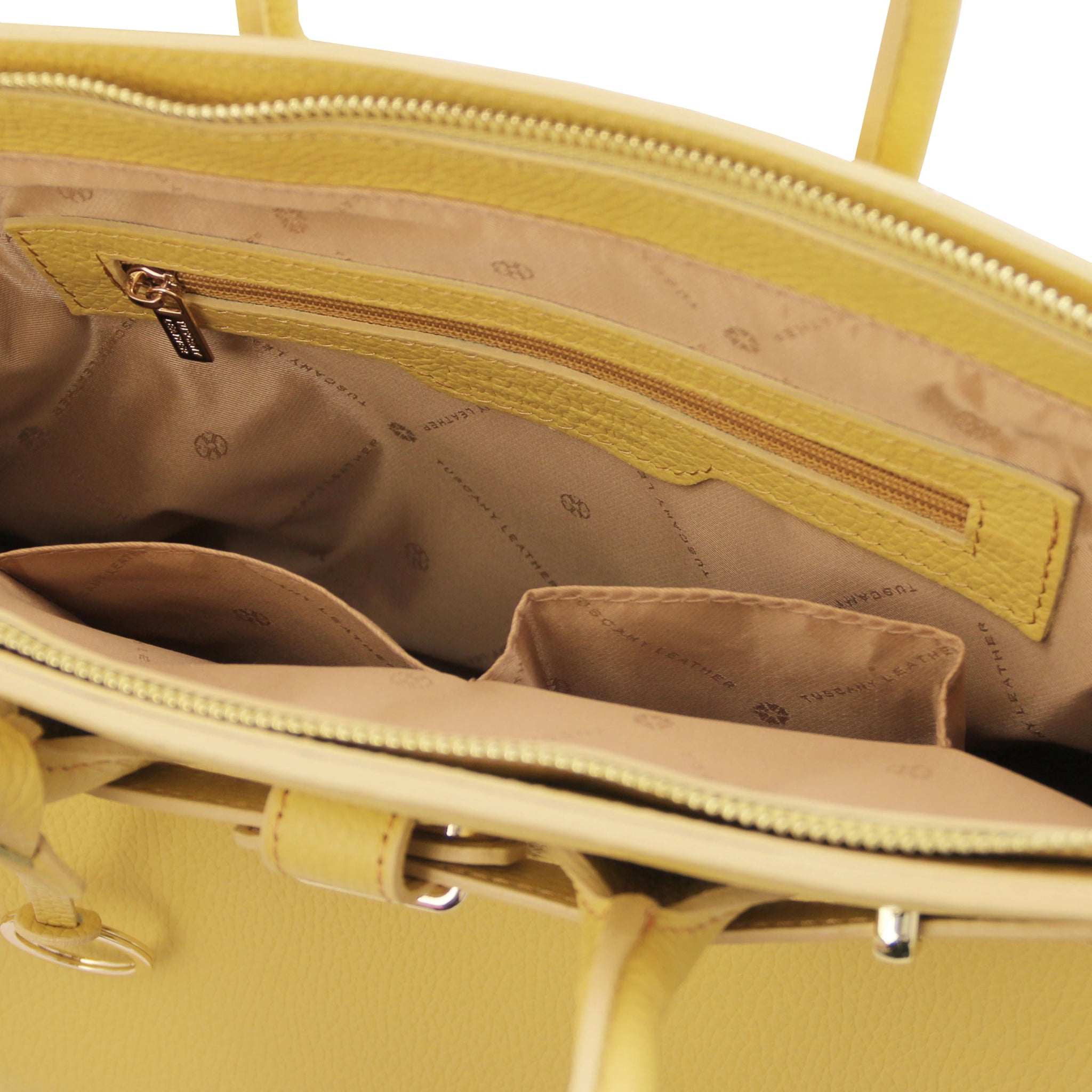 TL Italian Leather Handbag with Golden Hardware in cognac interior zip and open pockets view, beige lining on white background