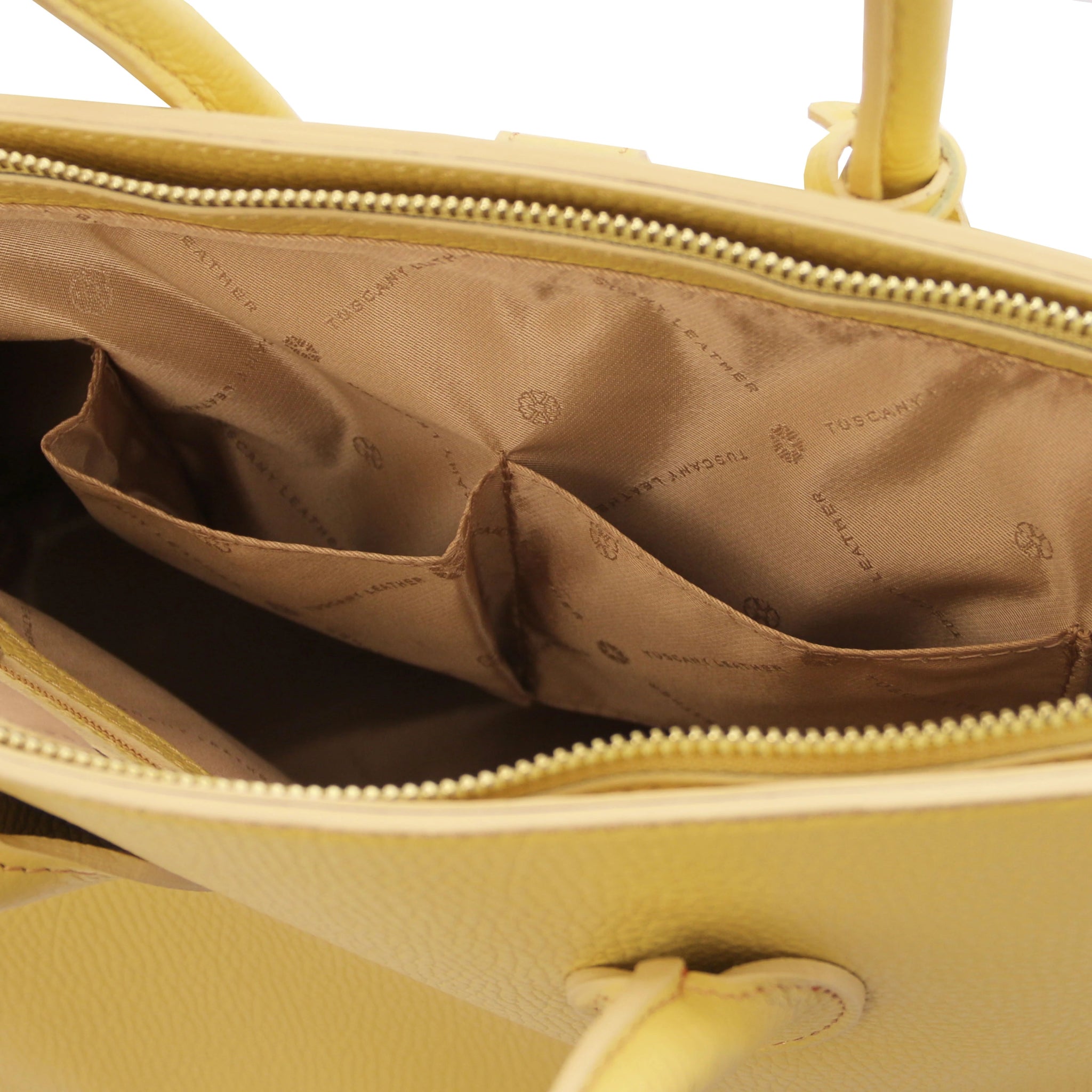 TL Italian Leather Handbag with Golden Hardware in cognac interior open pockets view, beige lining on white background
