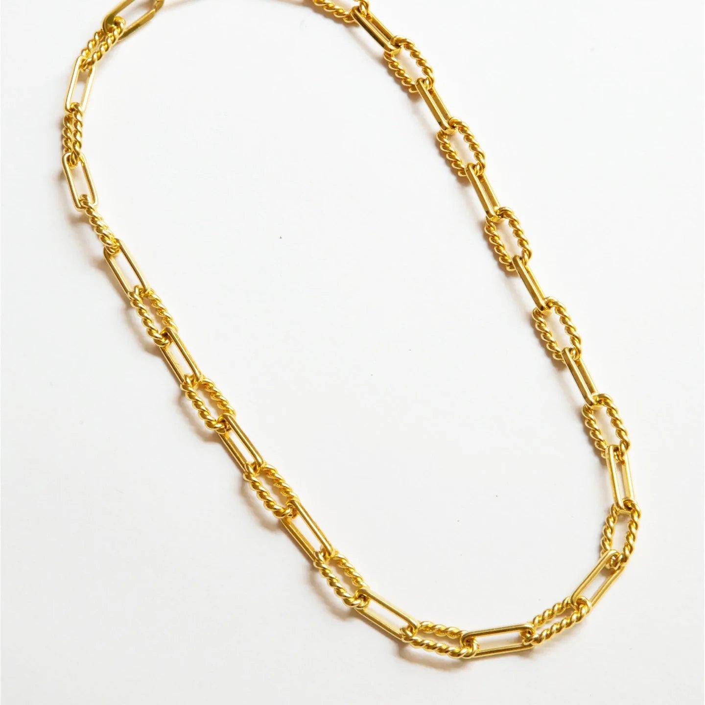 Vintage Glam Gold Vermeil Necklace laid angled on a white background