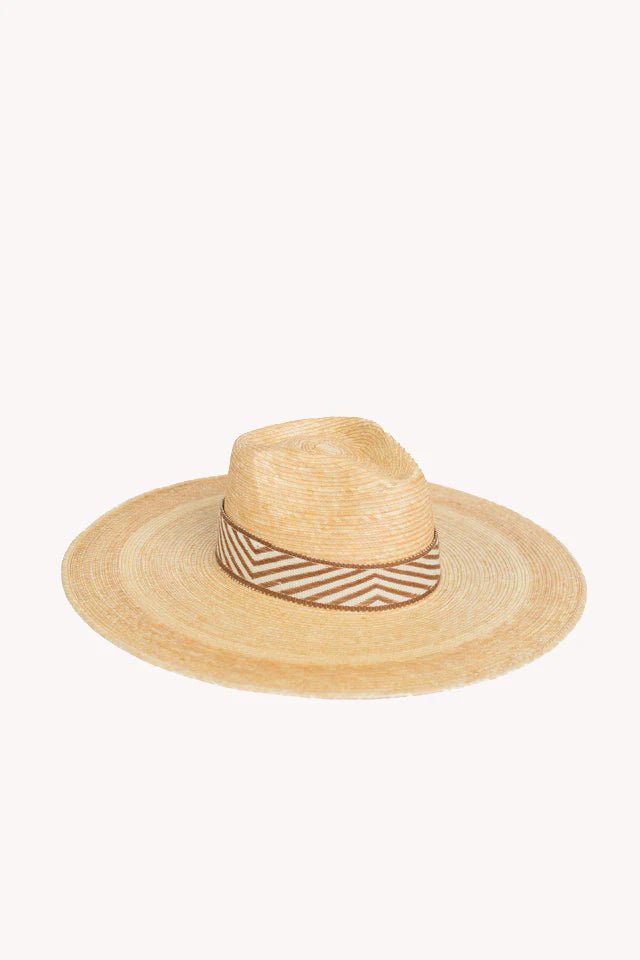 Western wide brim palm leaf straw hat on a white background