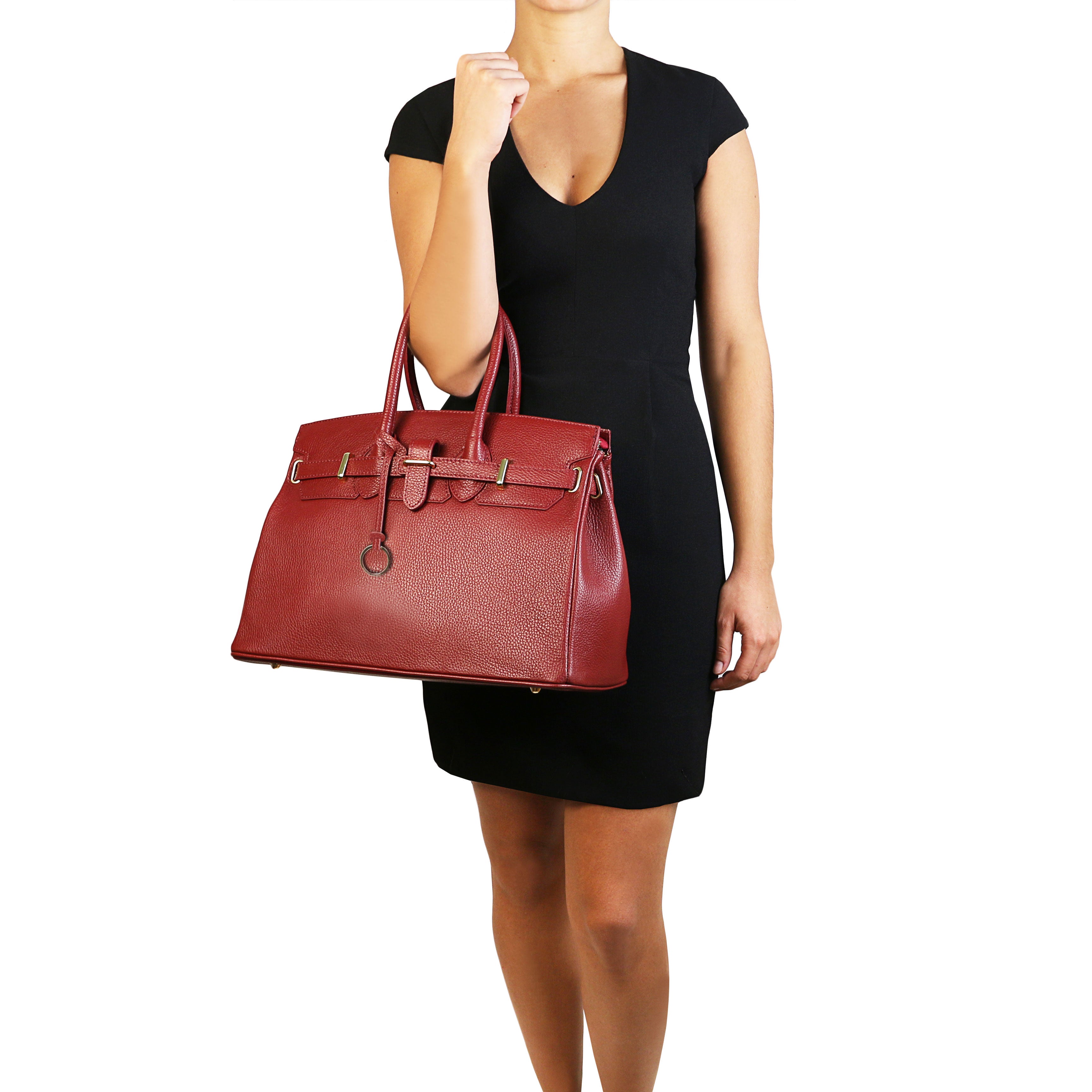 TL Italian Leather Handbag Golden Hardware in red, model wearing black dress holding bag, white background - L'Atelier Global
