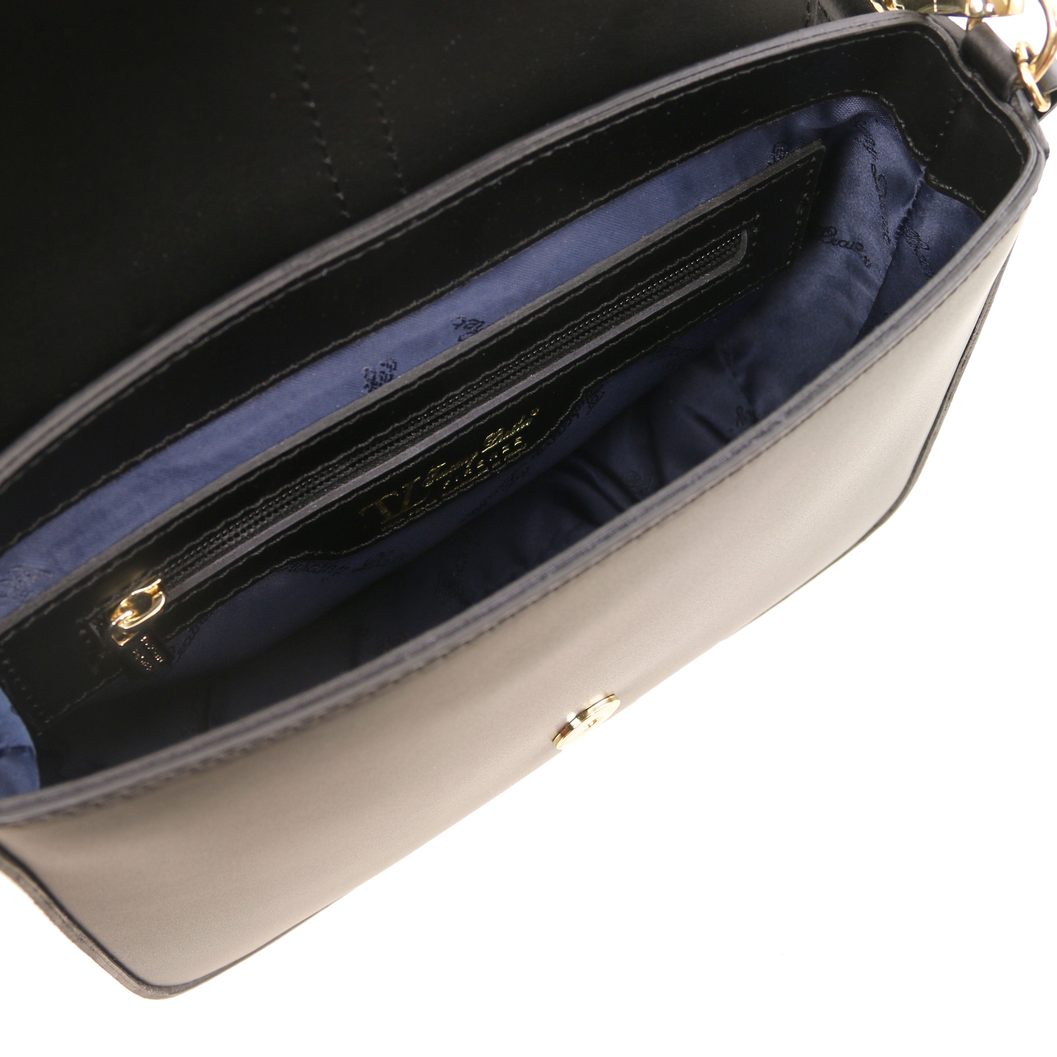 Interior Zip Pocket View Nausica Leather Shoulder Bag in Black showing navy blue lining