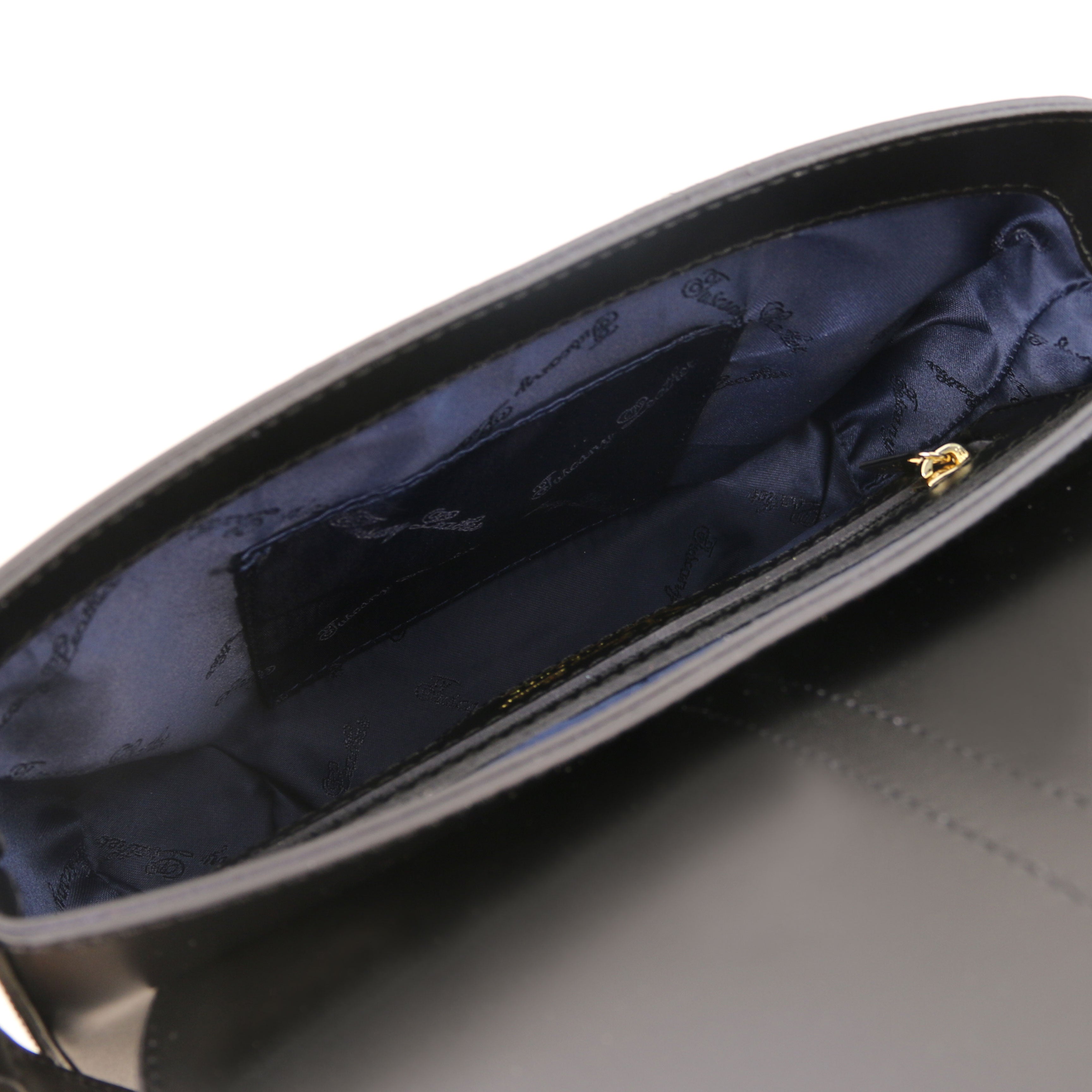 Interior Open Pocket View Nausica Leather Shoulder Bag in Black showing navy blue lining