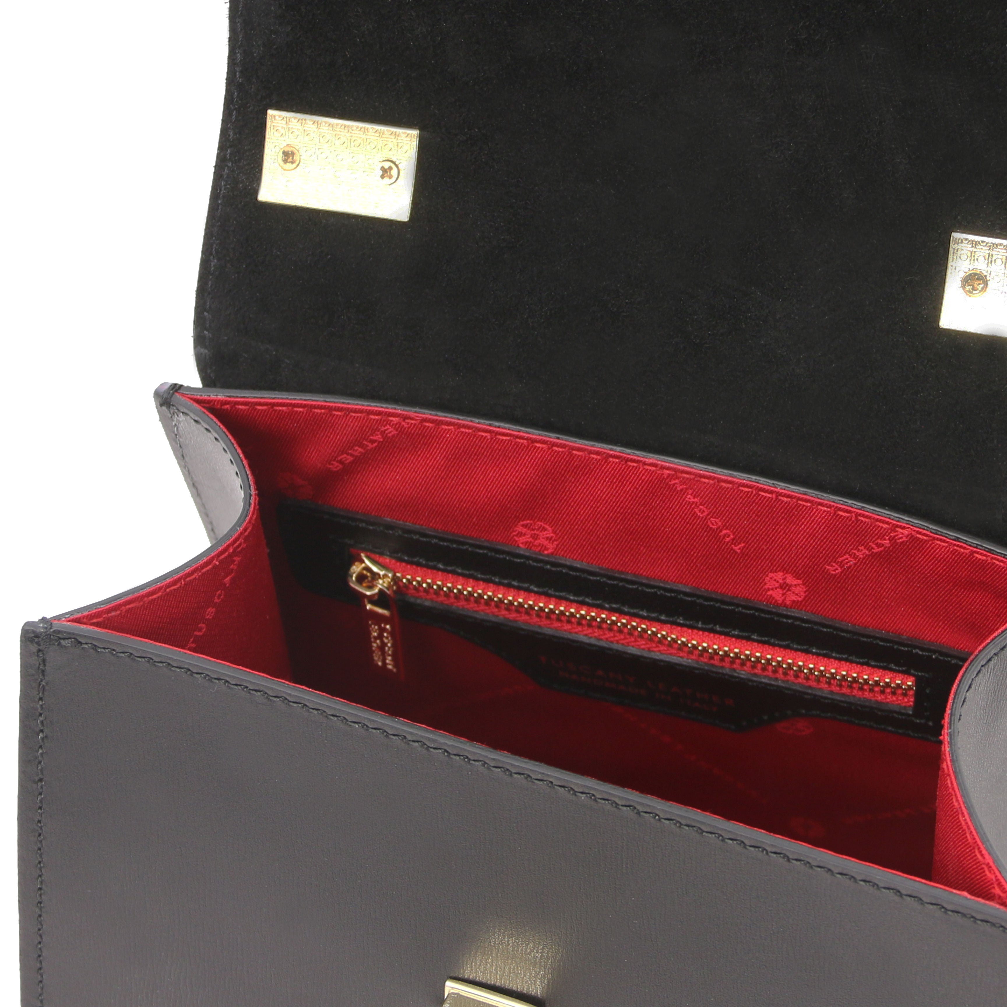 Interior zip pocket view TL Bag Italian Leather Mini Bag in black with red lining.