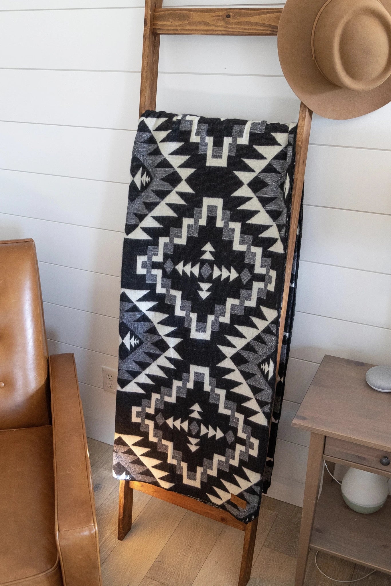 Andean Black Chakana Alpaca Wool Blanket laying on wooden ladder leaning on wall - L'Atelier Global