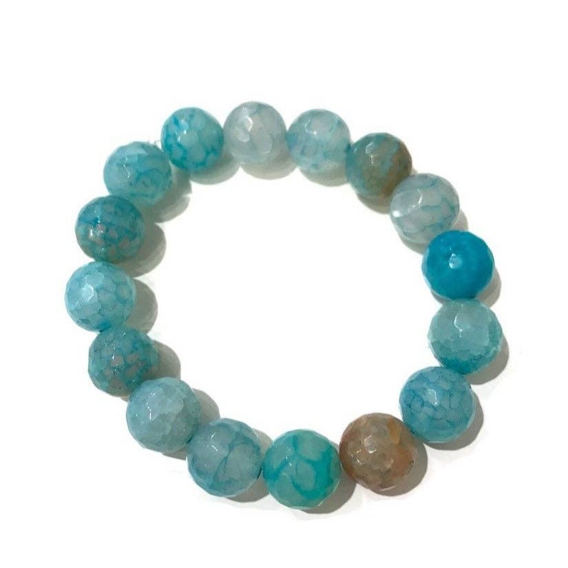 Aquamarine Natural Gemstone Stretch Bracelet on a white background showing the hue variations of soft to vibrant - L'Atelier Global