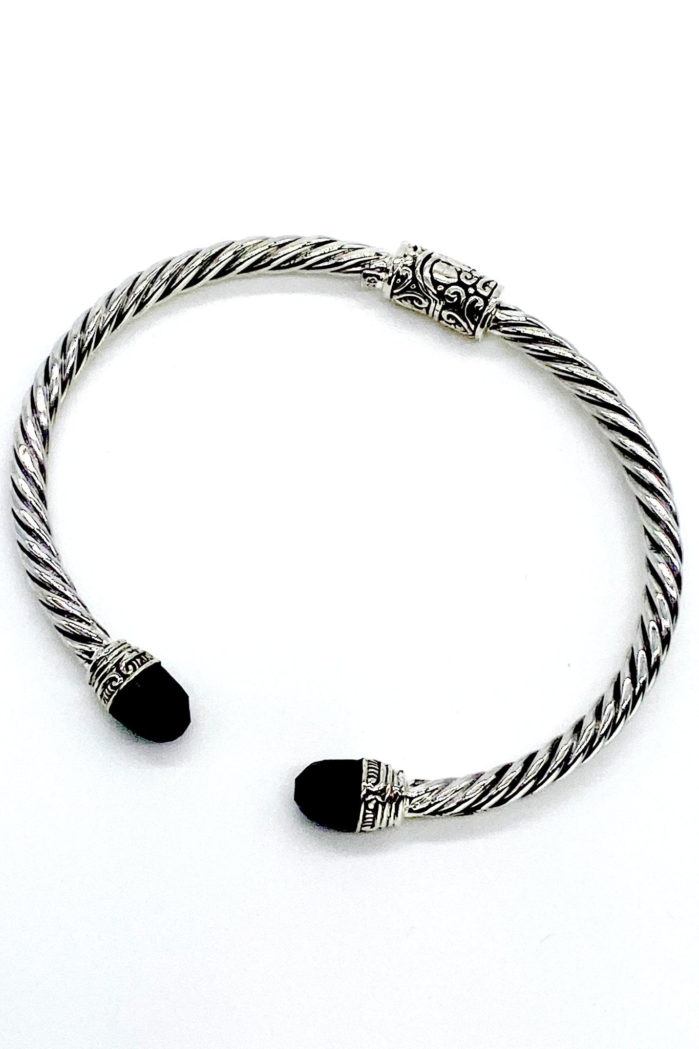 Balinese Silver Hinged Bracelet in Black Onyx, featuring a Balinese design engraved into the hinge and faceted black onyx gemstones