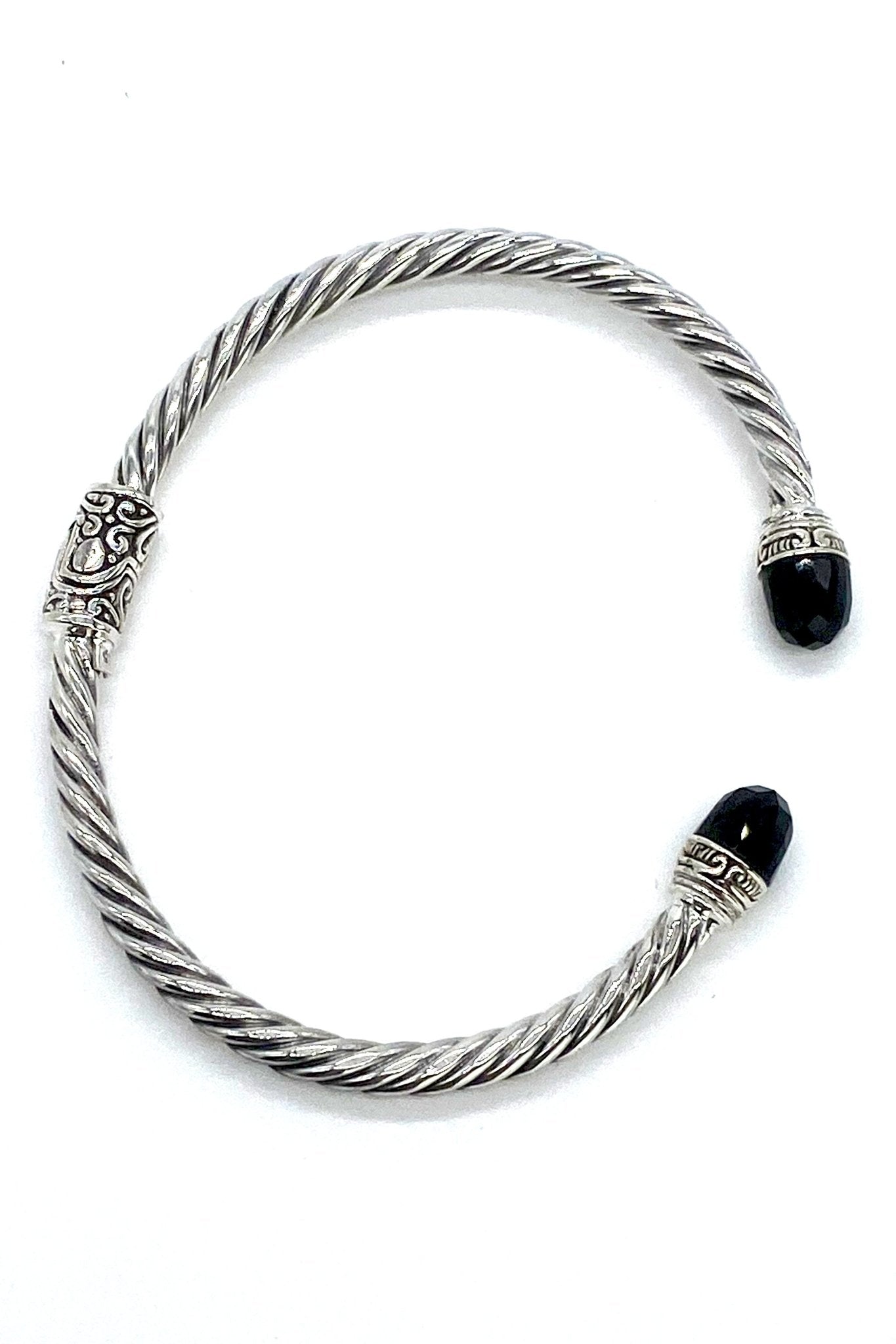 Balinese Silver Hinged Bracelet in Black Onyx, featuring a swirl-engraved design and faceted black onyx gemstones