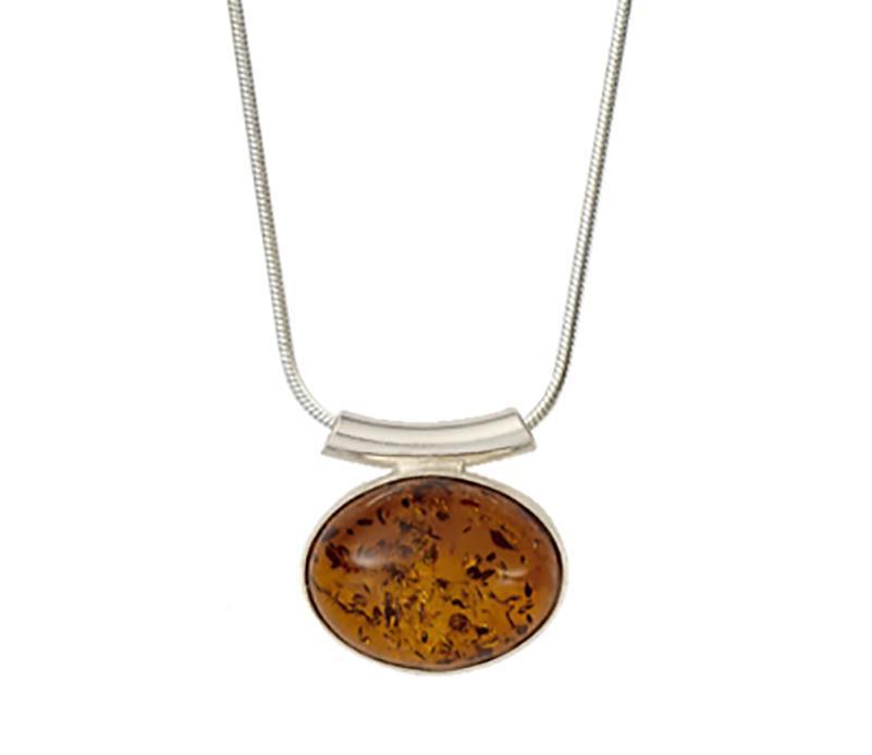 Baltic Honey Amber Slide Pendant Necklace is hanging in front of a white background. The natural flecks of the amber are clearly seen.