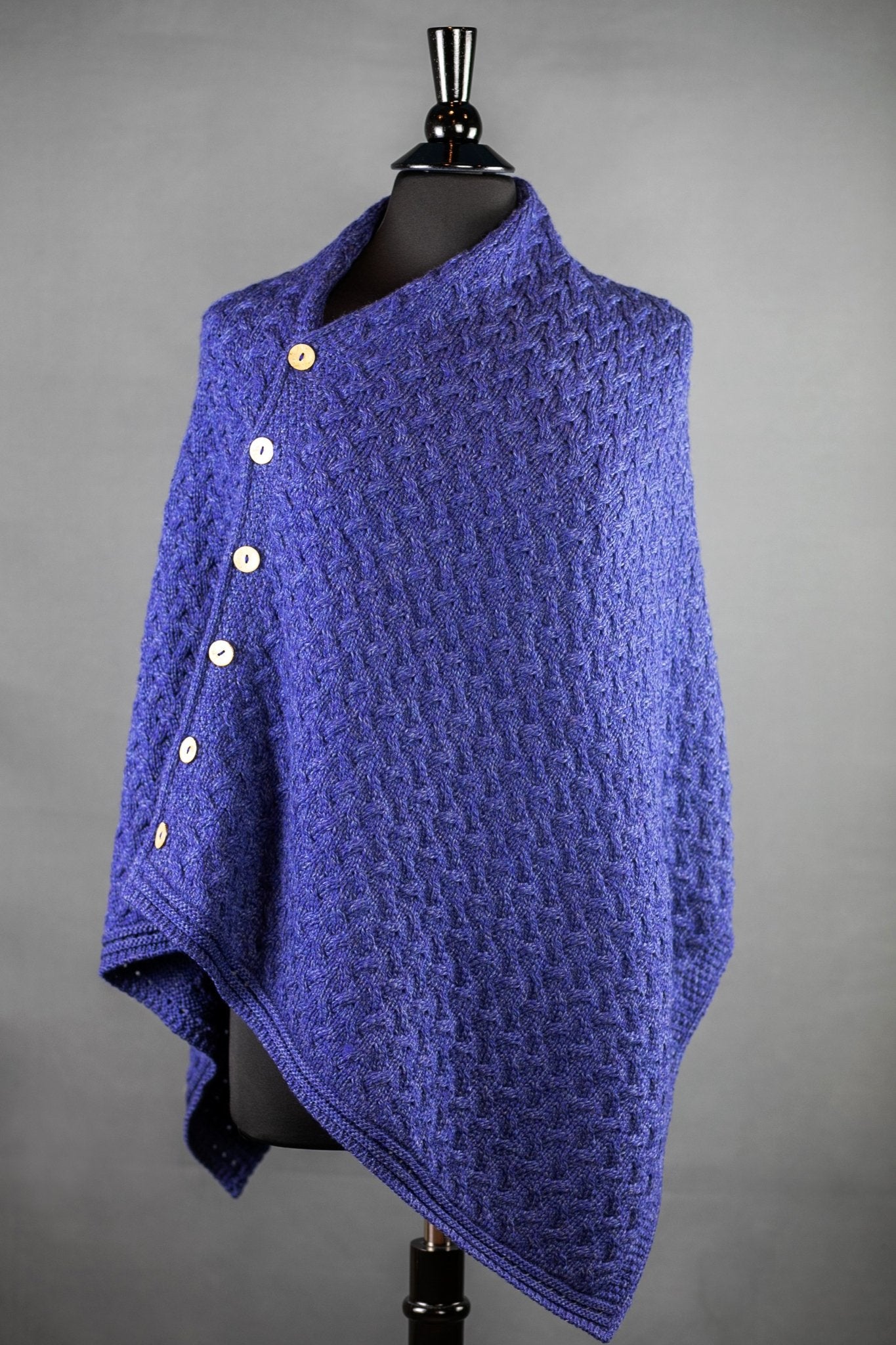 Irish Clew Bay Supersoft Convertible Cape in blue on a bust form