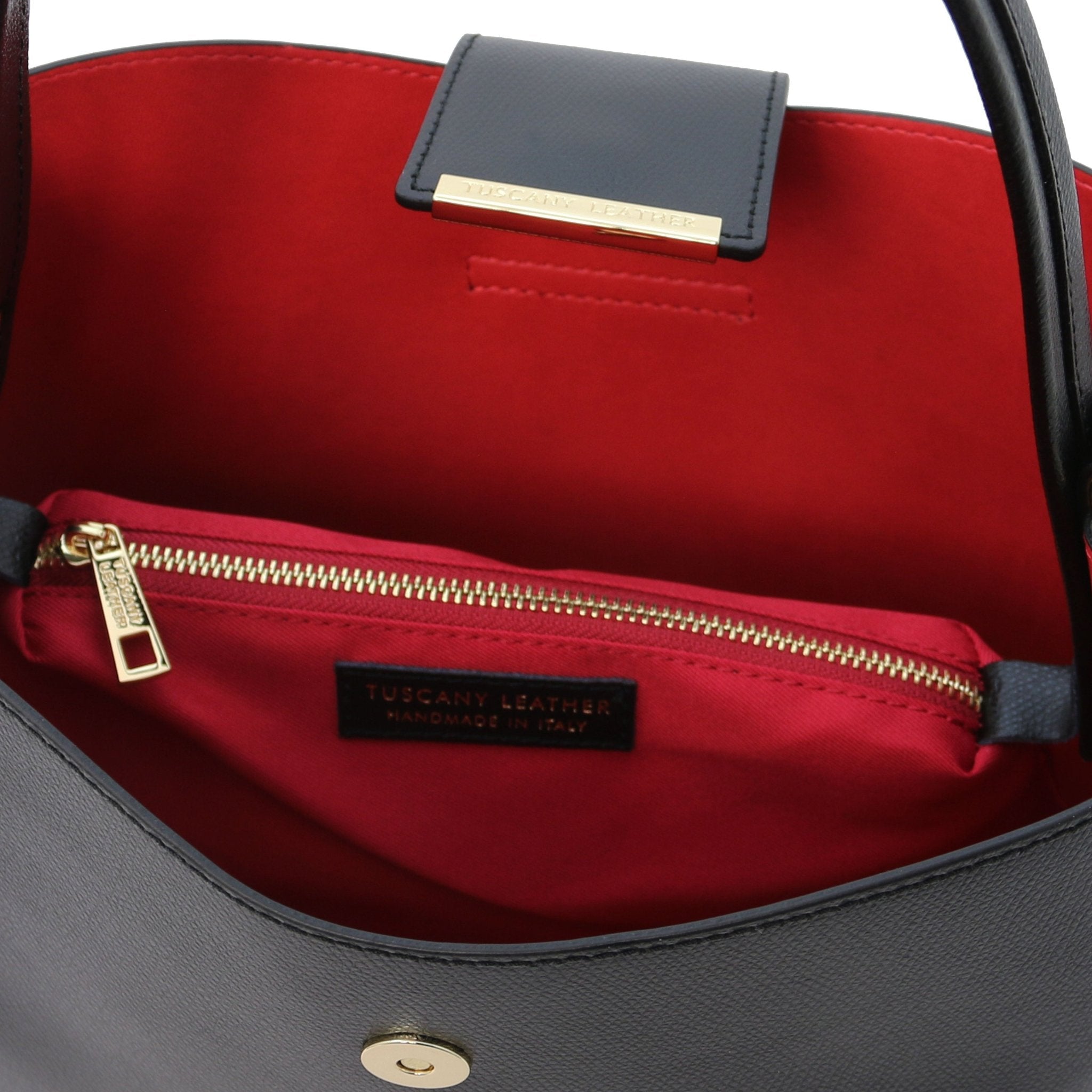 Interior central zippered compartment and vibrant red lining view of the Clio Italian Pebbled Leather Secchiello Bag in black