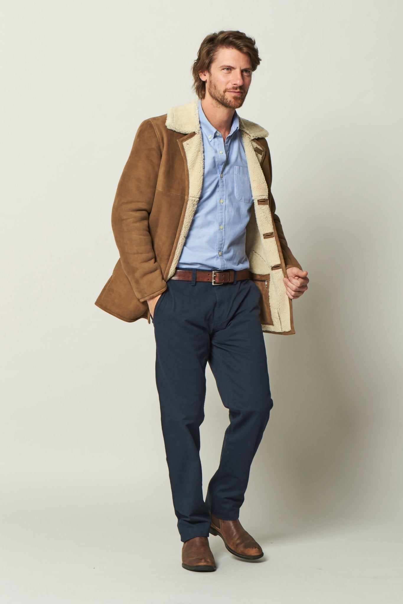 Dorset Sheepskin Jacket in Brandy on a male model wearing black pants - L'Atelier Global