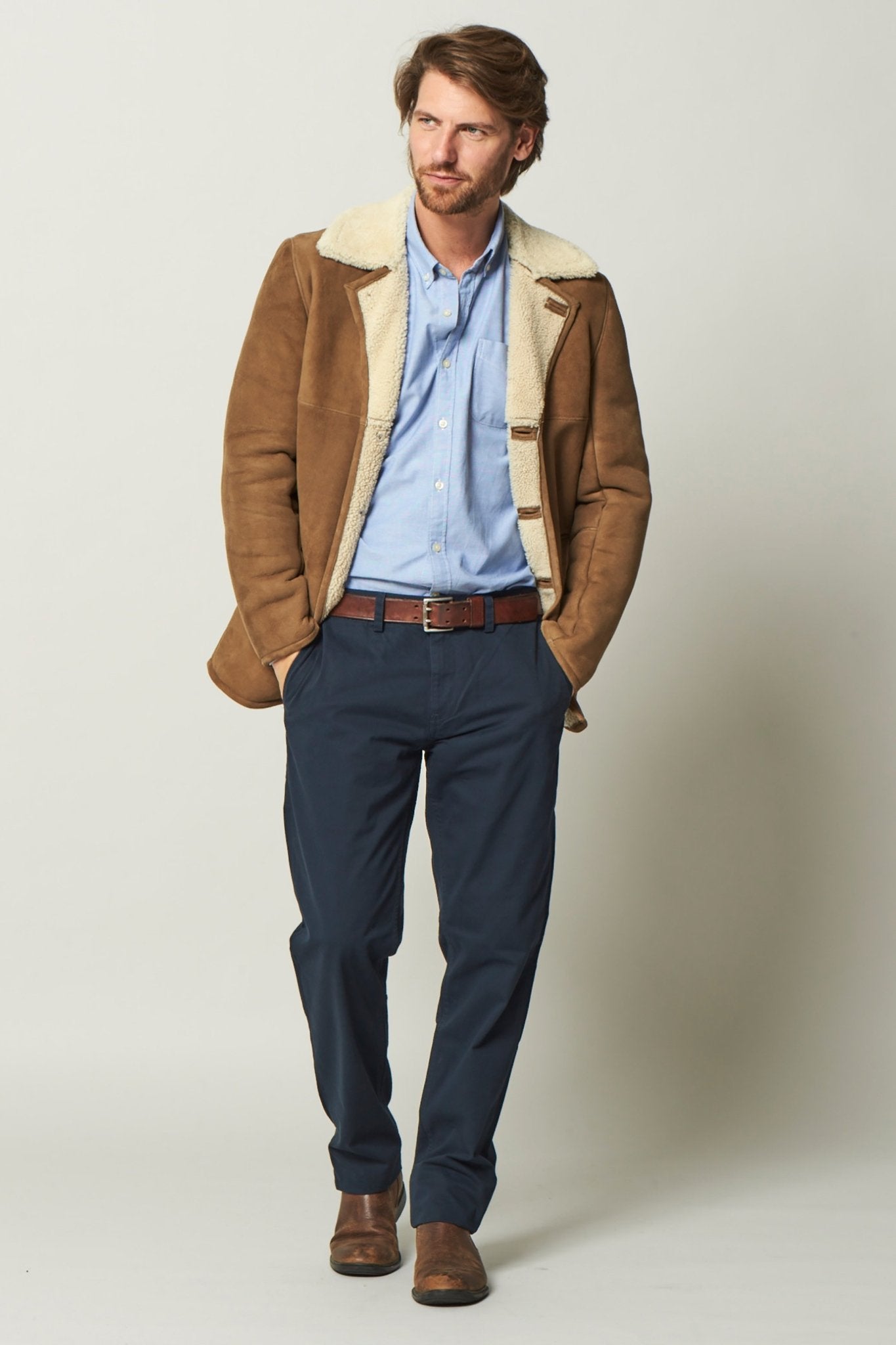 Dorset Sheepskin Jacket in Brandy on a male model wearing black pants - L'Atelier Global