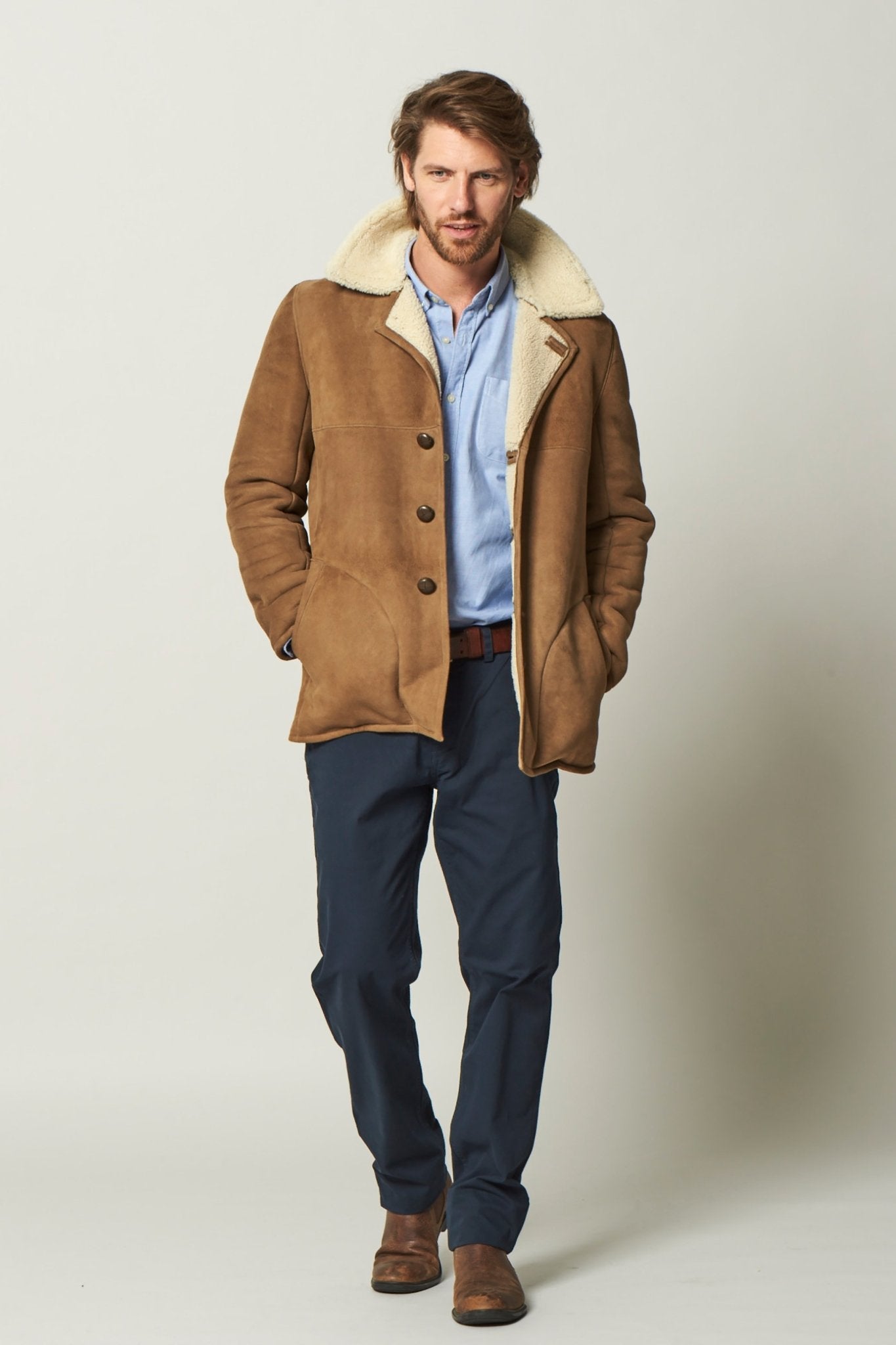 Dorset Sheepskin Jacket in Brandy on a male model wearing black pants - L'Atelier Global