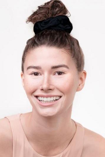 Eco-Friendly Towel Scrunchies in black on model on a white background