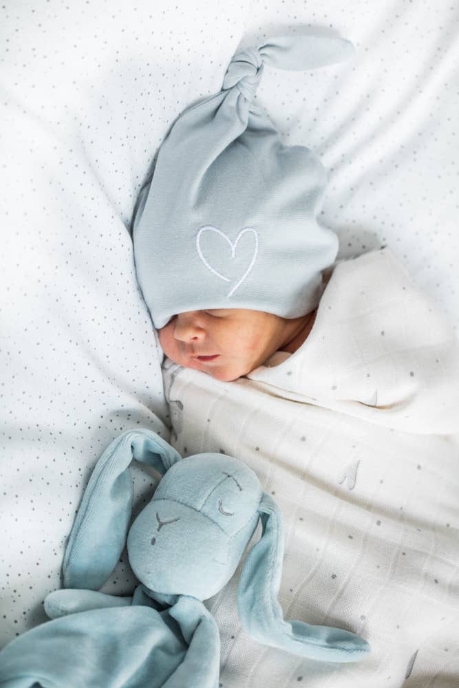 Effik Doudou in Blue in an adorable babies hands - L'Atelier Global