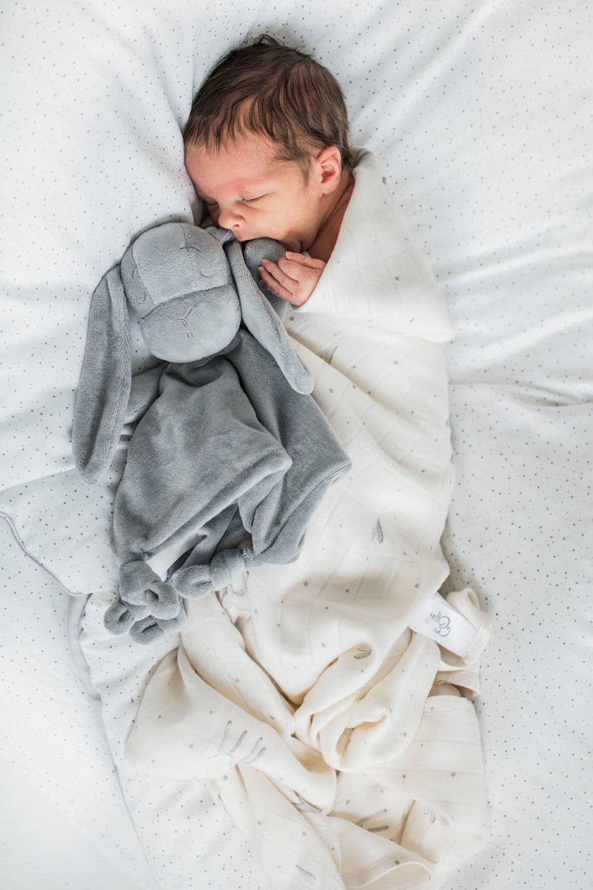 Effik Doudou in Gray in an adorable babies hands - L'Atelier Global