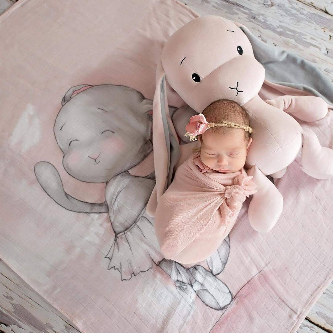 Effik The Pink Bunny laying with a baby girl - L'Atelier Global