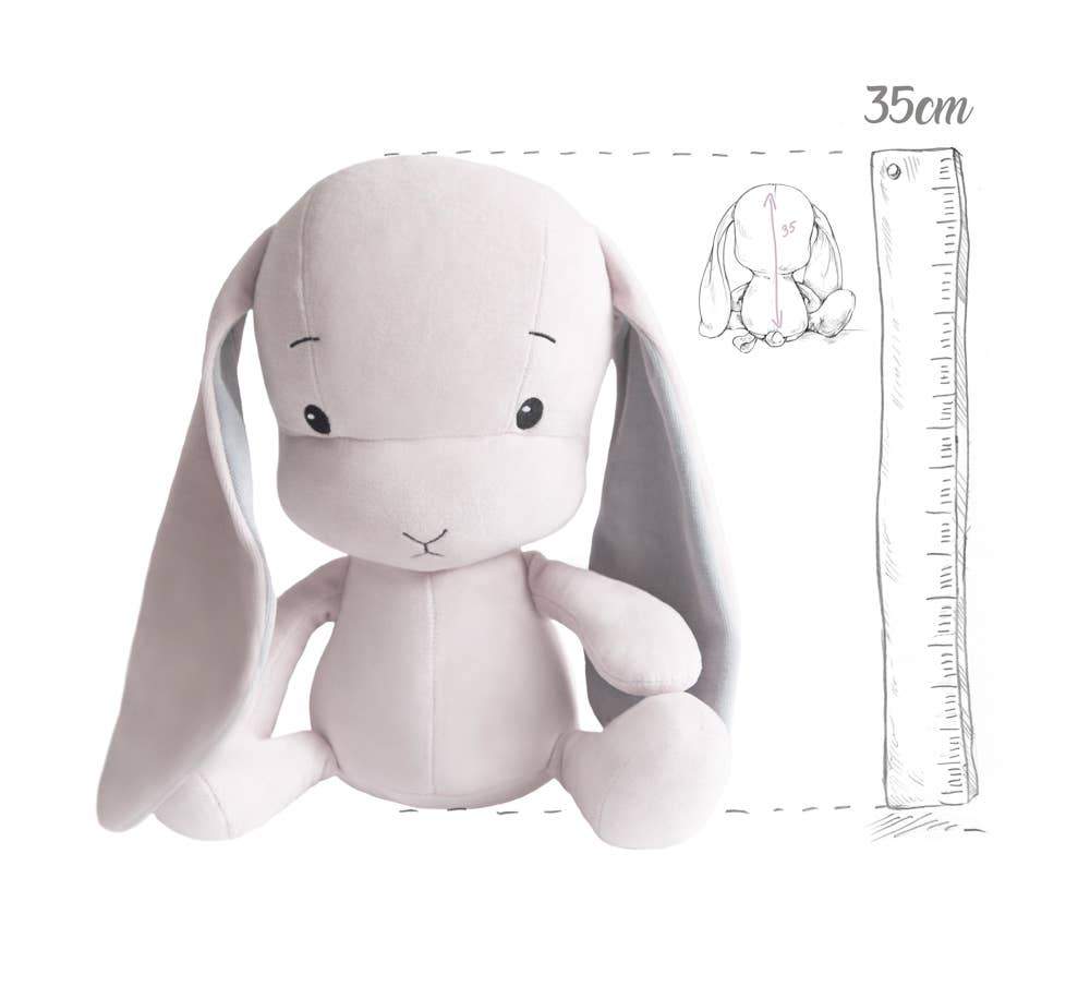 Effik The Pink Bunny on a white background next to a ruler showing its size.