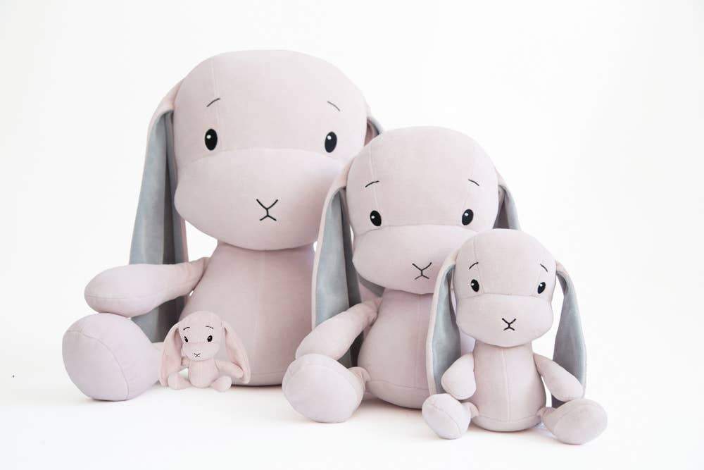 A group of different-sized Effik Pink Bunnies on a white background - L'Atelier Global