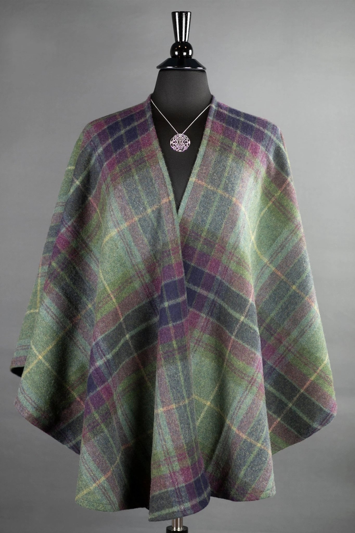 Emerald Isle Heathered Green Wrap on a Bust Form on gray background