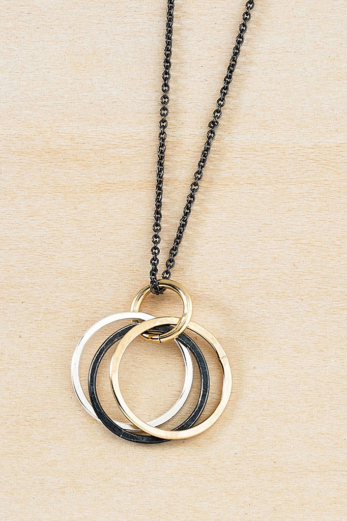 Endless Possibilities Oxidized Sterling Silver Necklace on a kraft paper background