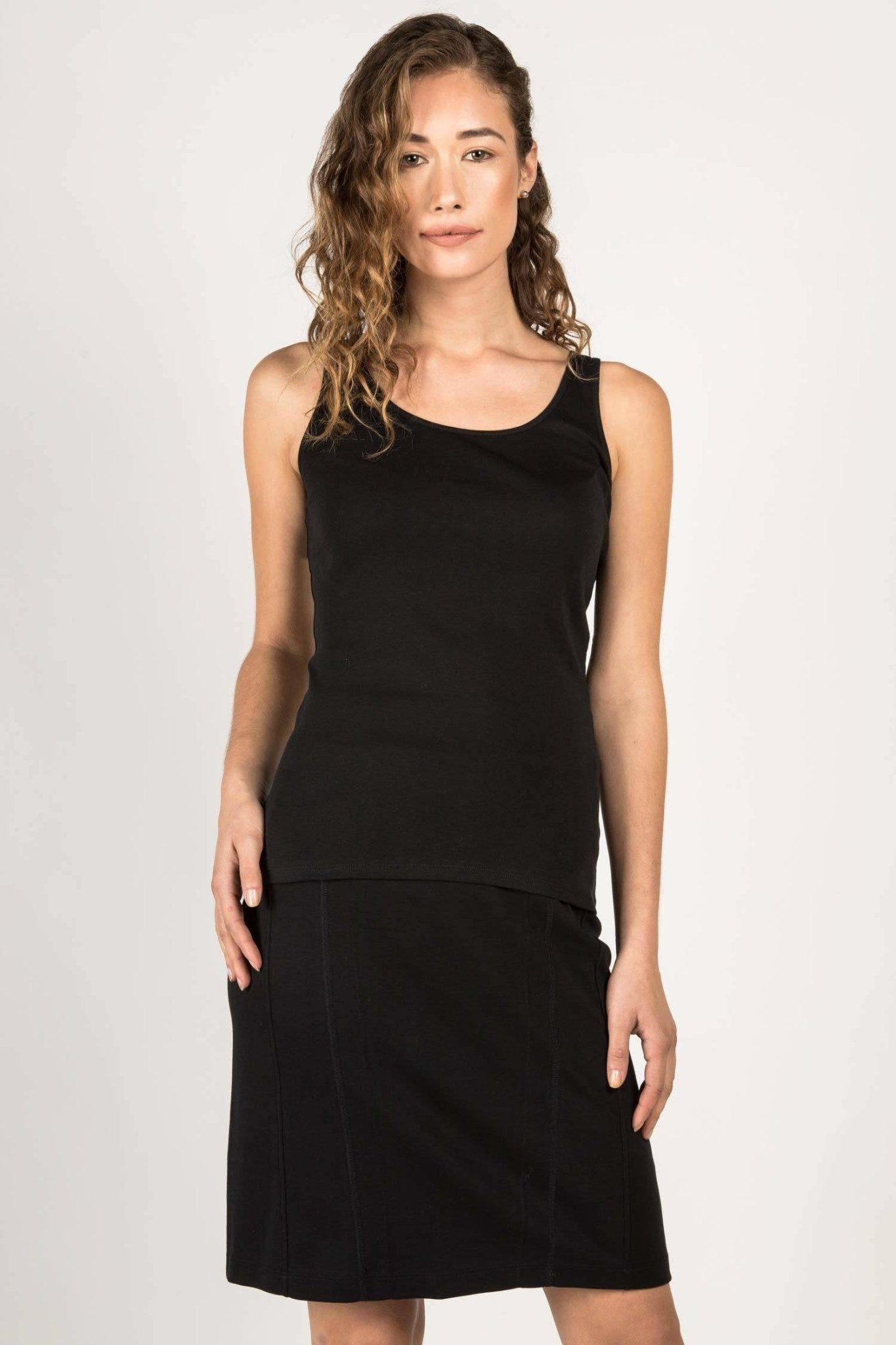 Essential Pima Cotton Long Layering Tank in Black on a female model wearing a black skirt - L'Atelier Global