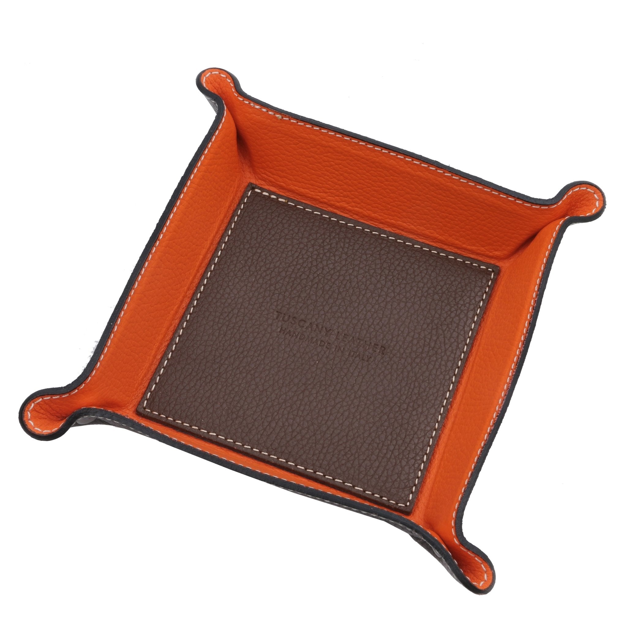 Exclusive Leather Valet Tray in light taupe on a white background, featuring a dark brown interior bottom with the Tuscany Leather embossed logo and orange interior sides.