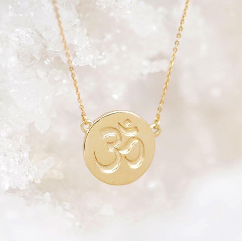 Irish Inner Peace Gold Necklace on a cream background - L'Atelier Global