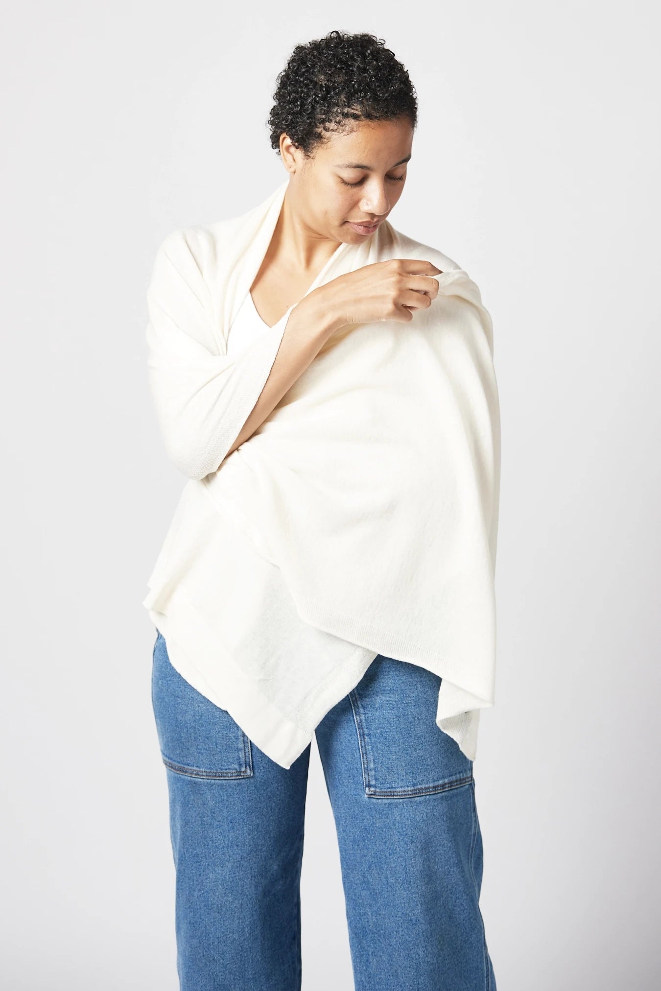 Ischia Cotton Blend Wrap in white on model around her neck