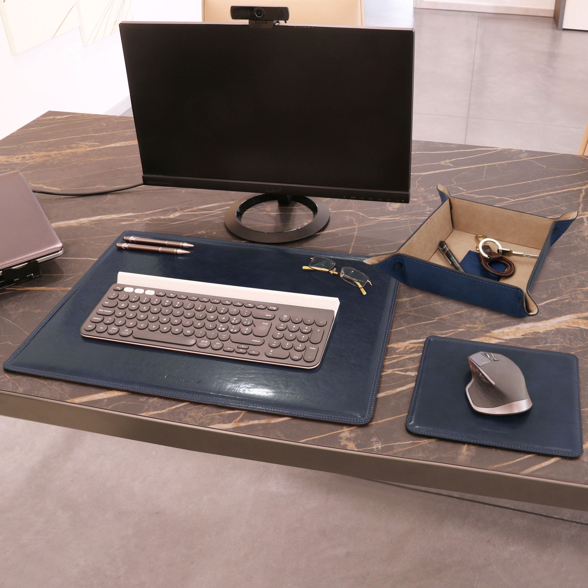 Office desk view of the Italian Leather Desk Pad, Mouse Pad and Valet Tray set in dark blue - L'Atelier Global