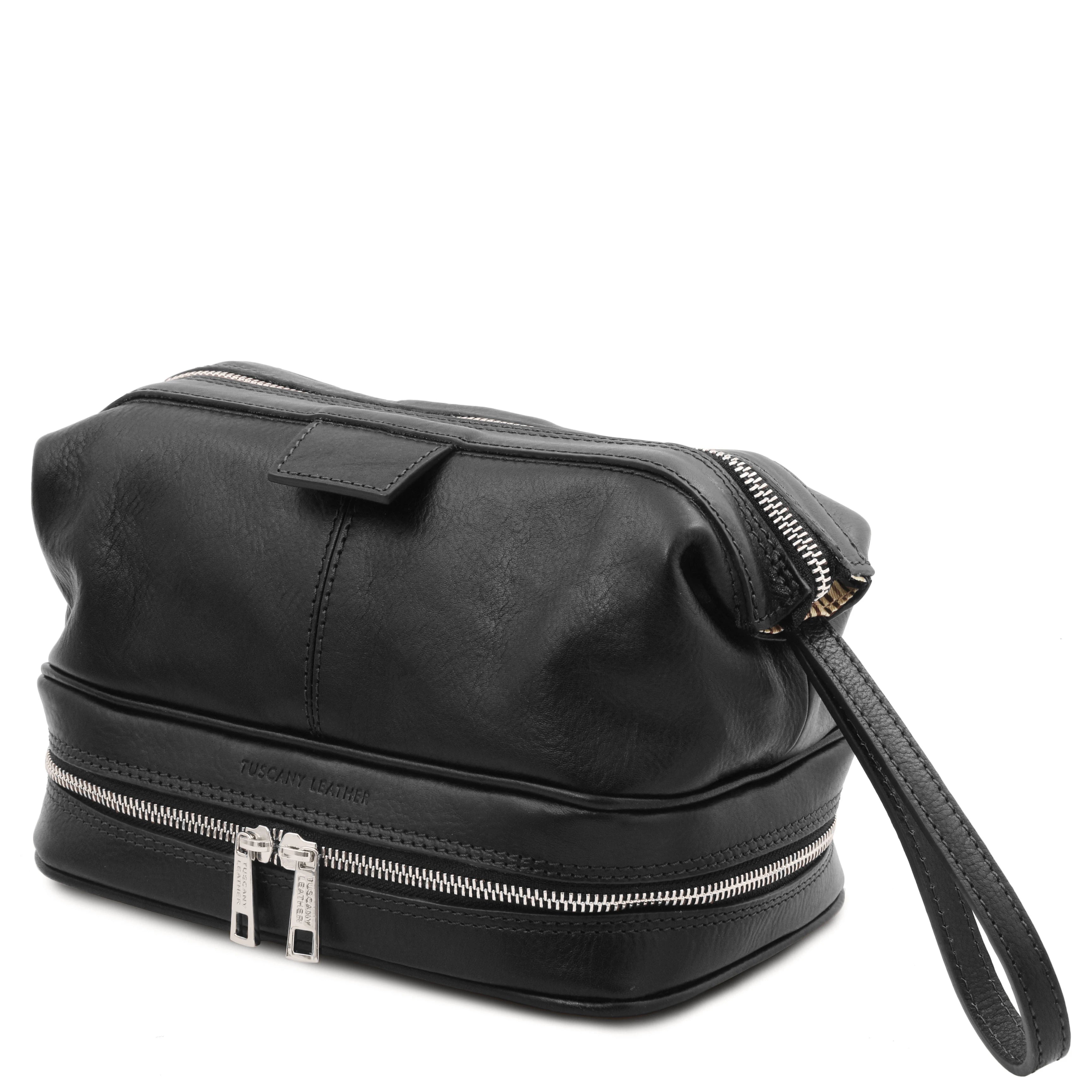 Side view showing handle, Jacob Leather Toilet Bag in black on a white background