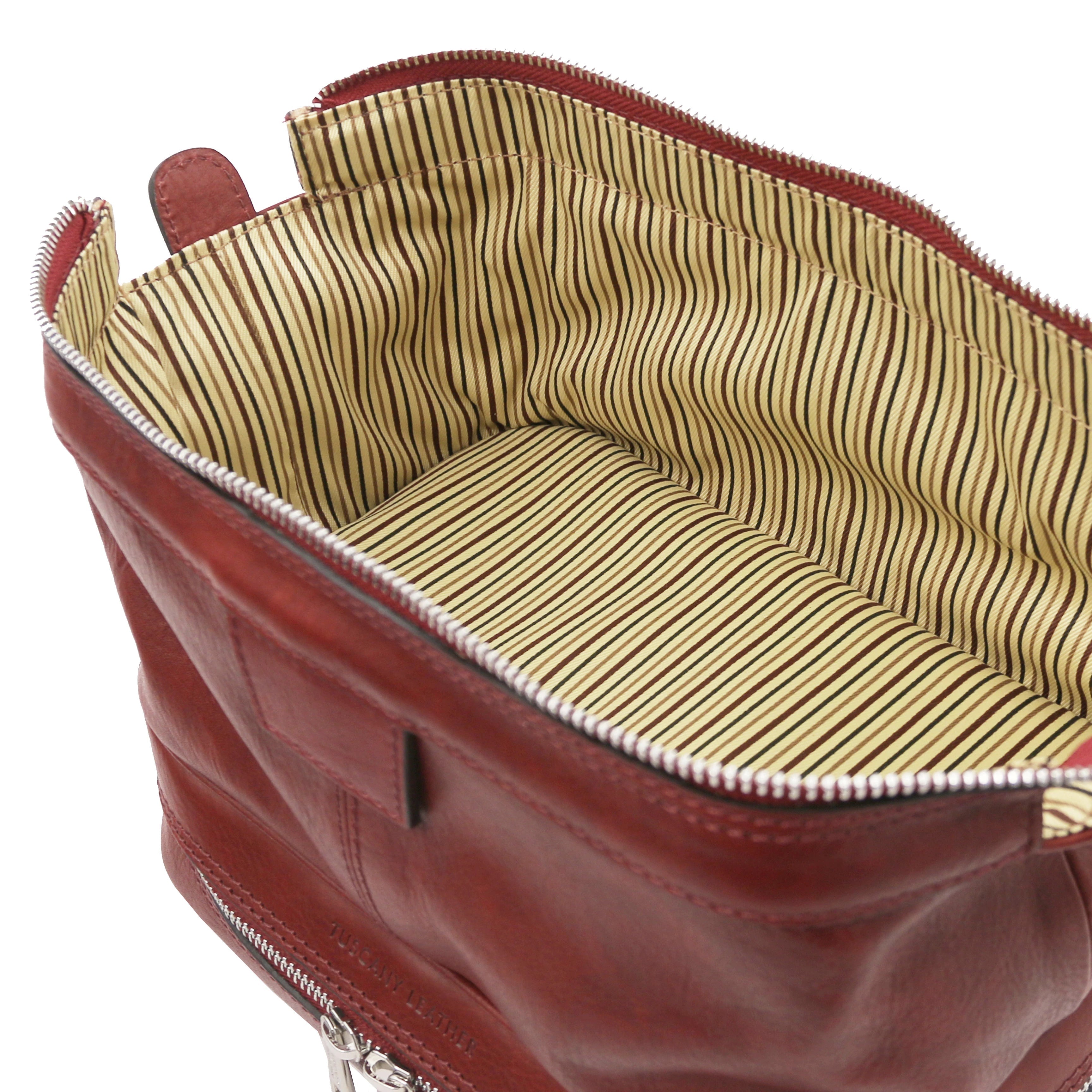 Fully opened bottom compartment view showing vintage striped interior, Jacob Leather Toilet Bag in red