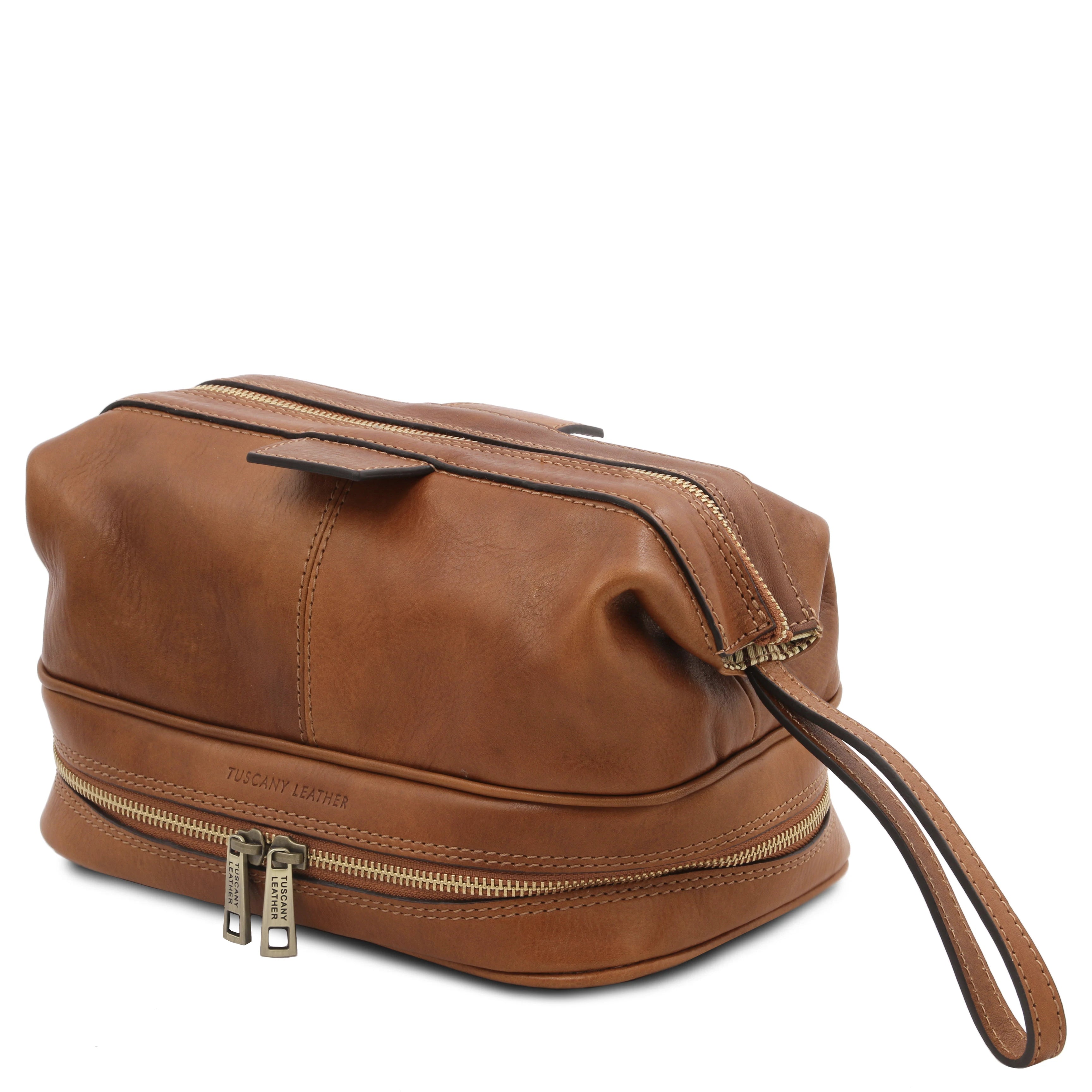 Side view showing handle, Jacob Leather Toilet Bag in natural on a white background