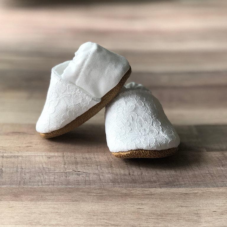Lacey White Cotton Canvas Moccasins on a soft ash hued wood table