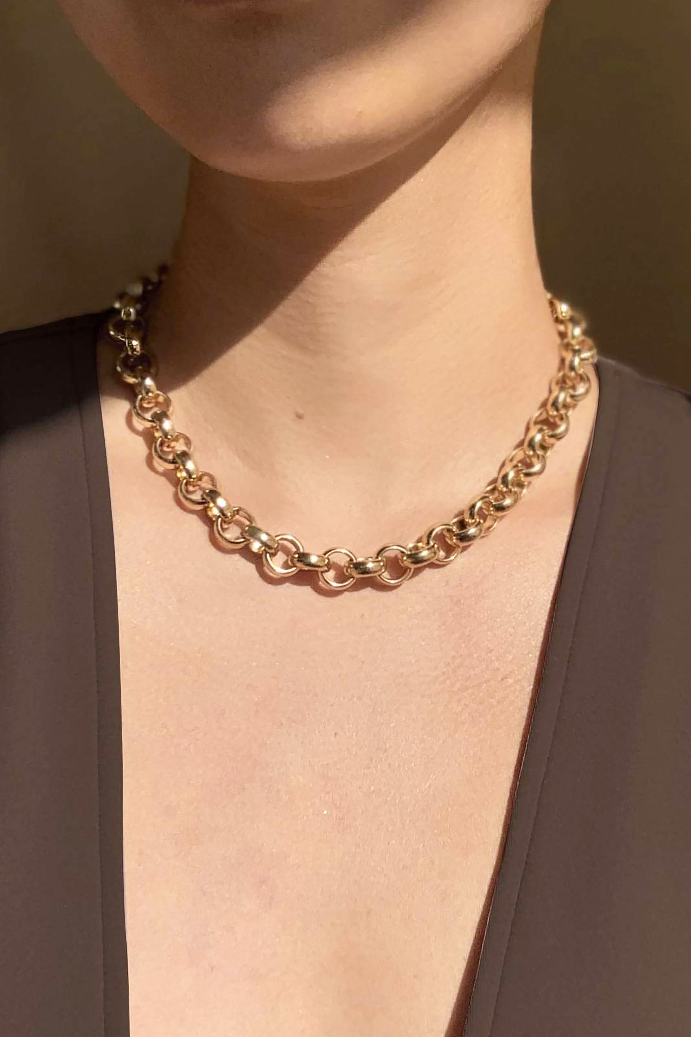 Minimalist Chunky Gold Chain Necklace on model wearing a brown v-neck top