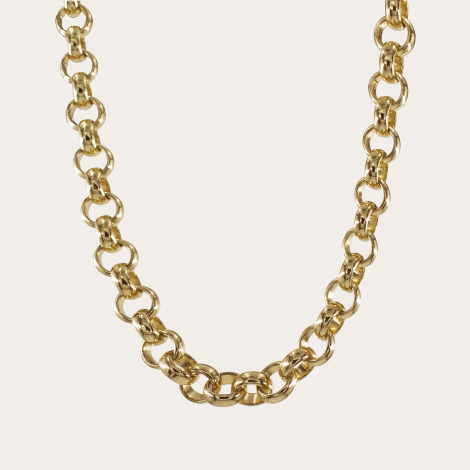 Minimalist Chunky Gold Chain Necklace hanging on a natural background-