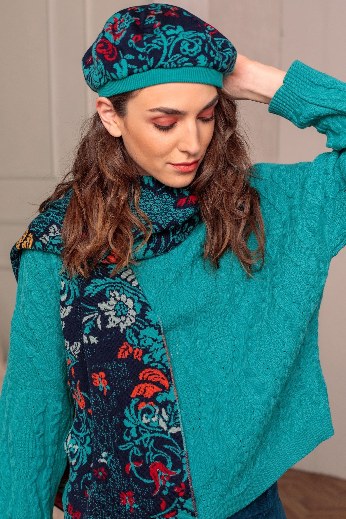 Lily of The Valley Serbian Merino Wool Scarf & Hat in Blue on model wearing a bright blue sweater
