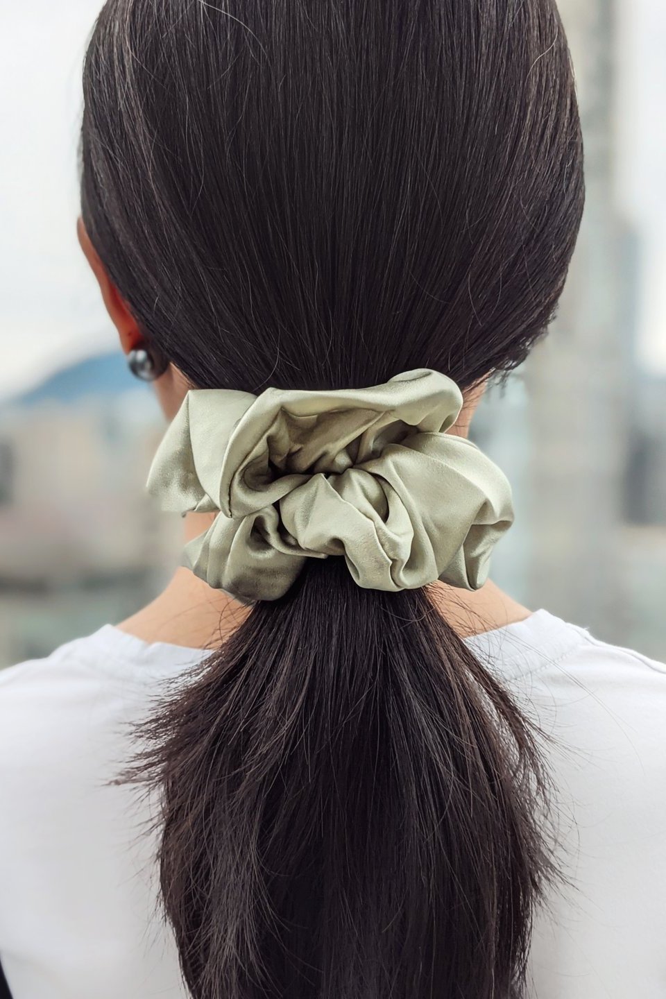 Luxe Mulberry Silk Jumbo Scrunchie in sage on a female model