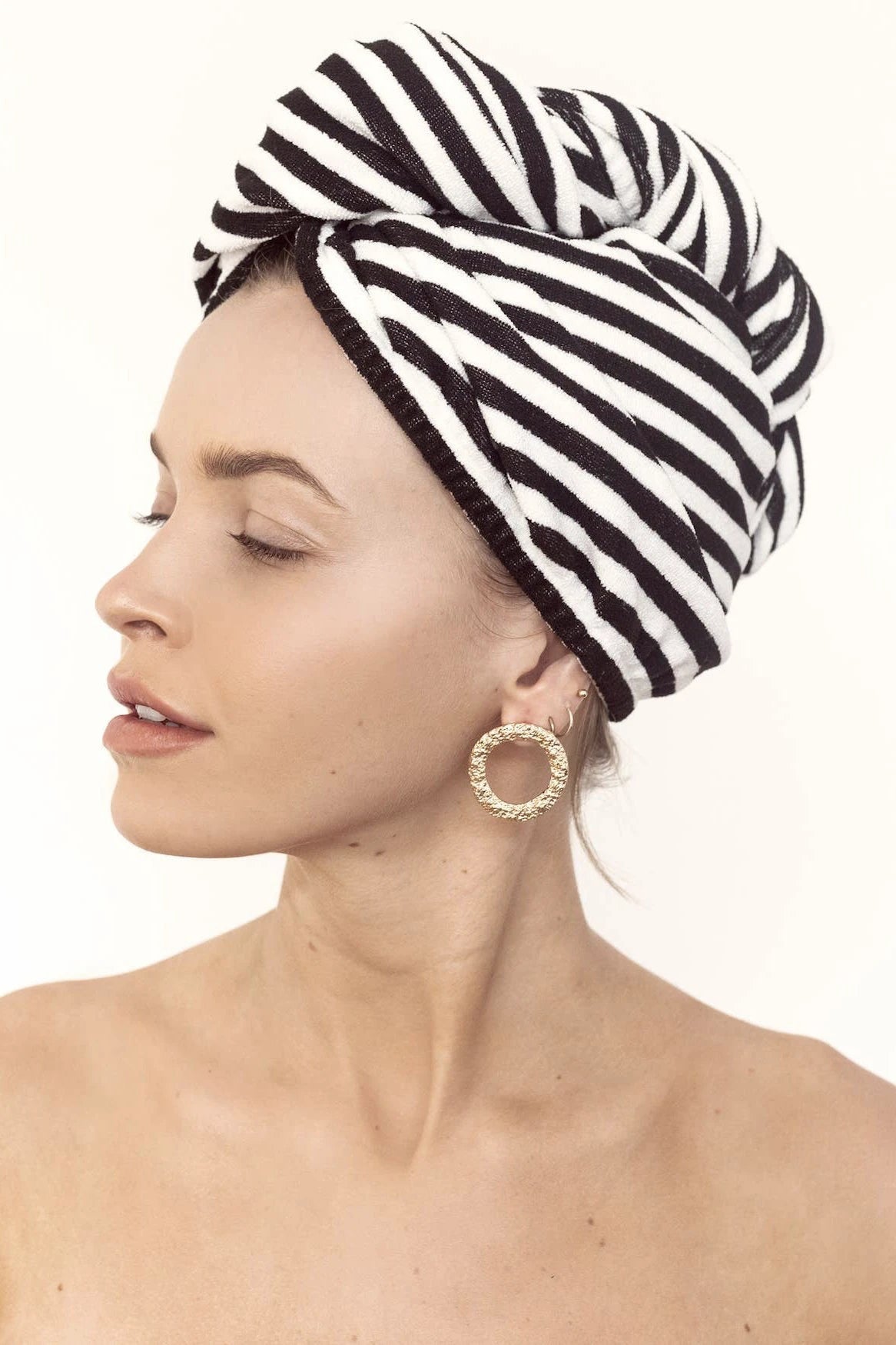 Side view Microfiber Hair Towel in Monochrome Stripe wrapped around a woman's head
