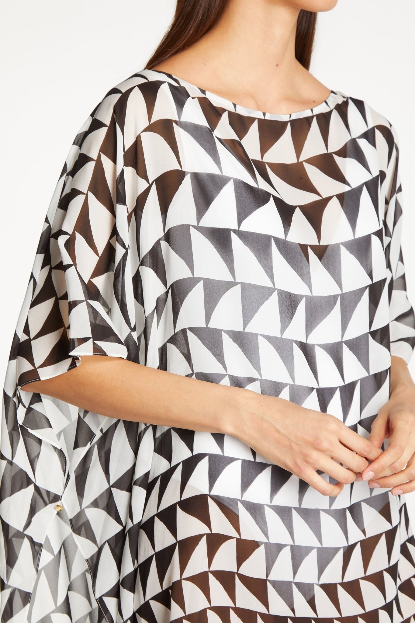 Top front view of the Naima Art Deco Cover Up on model wearing a white bathing suit - L'Atelier Global