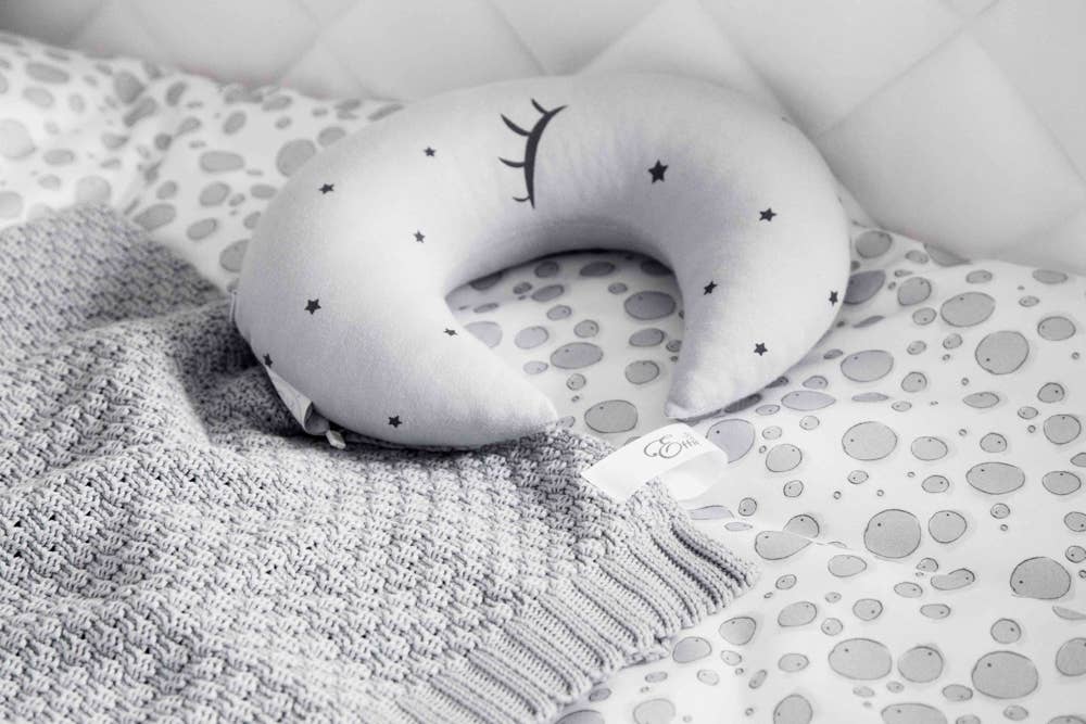 Natural Cotton Baby Blanket in Gray on a child's bed - L'Atelier Global
