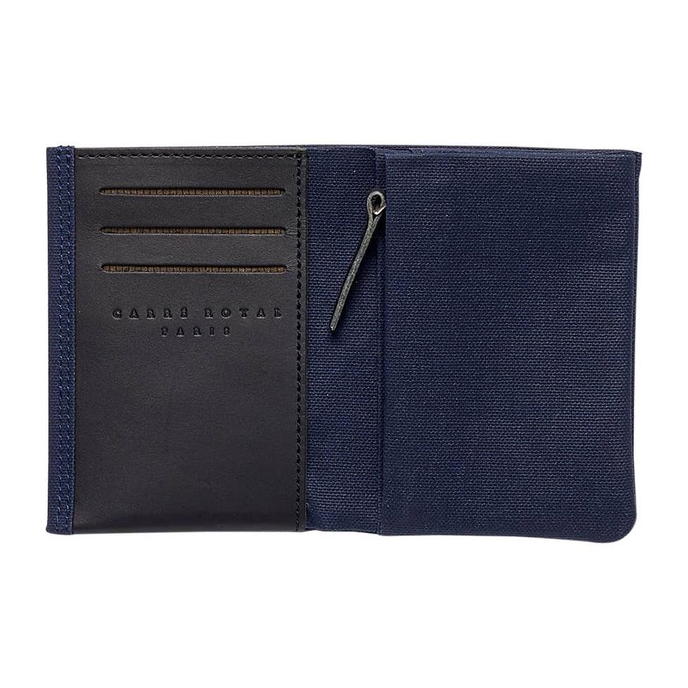 Interior pocket view of the Navy Minimalist Canvas and Leather Wallet on a white background showing card, open and coin pockets.